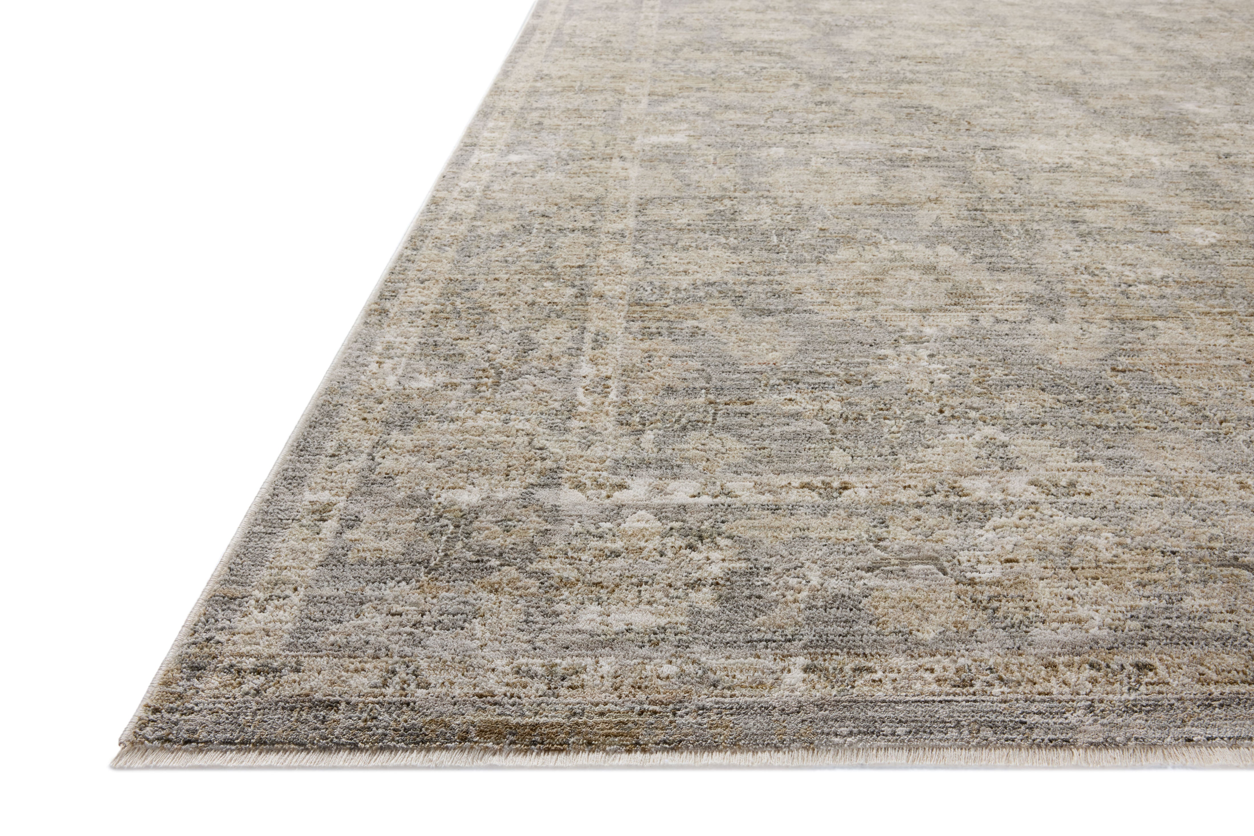 The Tabitha TAI-04 Slate / Natural Area Rug blends cool slate and warm natural tones and traditional motifs into a power-loomed polyester area rug with timeless appeal