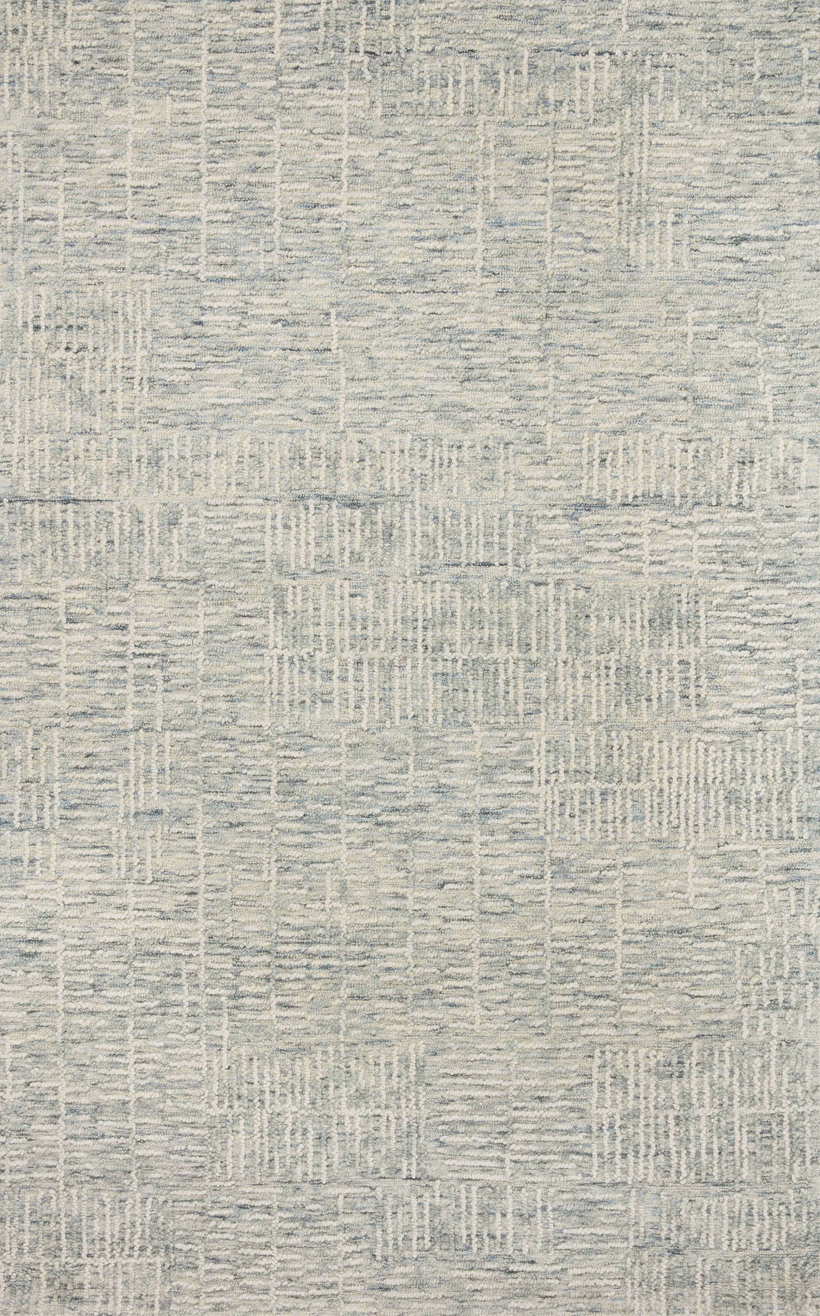 The Tallulah TLL-03 Sky / Ivory Area Rug pairs breezy sky-blue and refined ivory tones and abstract and linear patterns in a hand-tufted 100% wool area rug