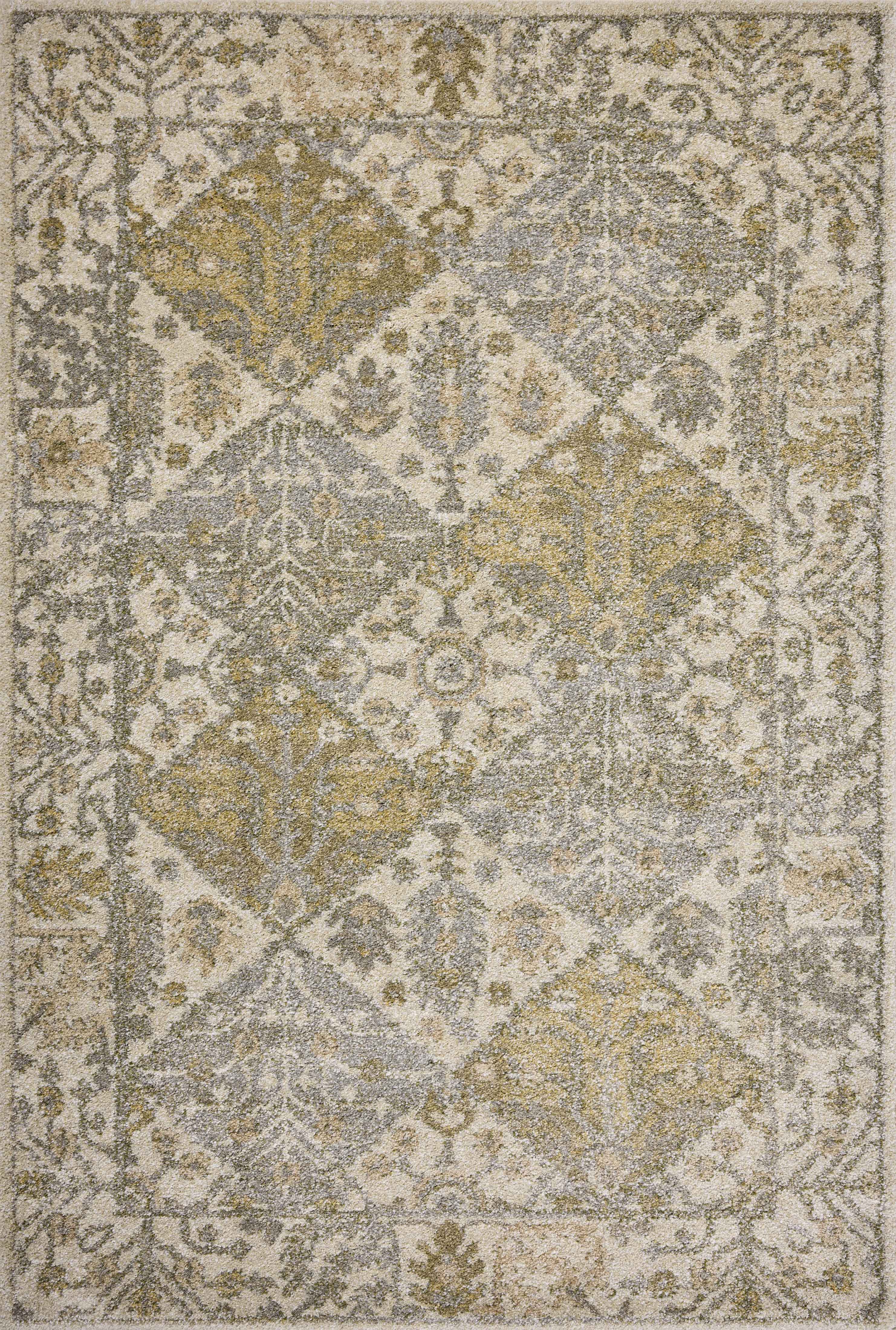 With warm beige and vibrant multi-toned hues, the Tamryn TAM-01 Beige / Multi Area Rug is a power-loomed 100% polypropylene area rug that elevates any room