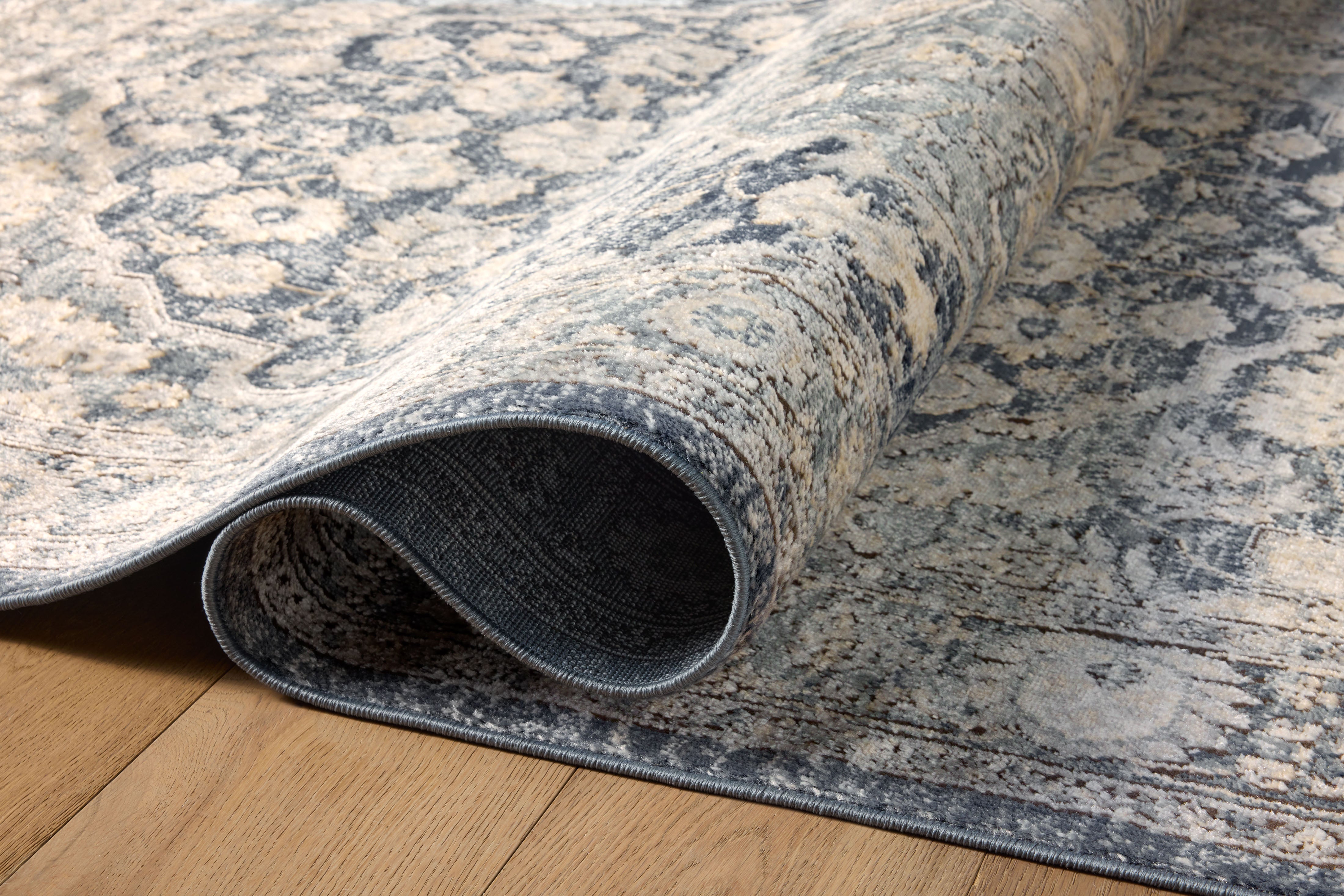 The Teagan TEA-01 Denim / Mist Area Rug combines casual denim and soft misty tones and contemporary patterns in a power-loomed polypropylene and polyester area rug for effortless elegance