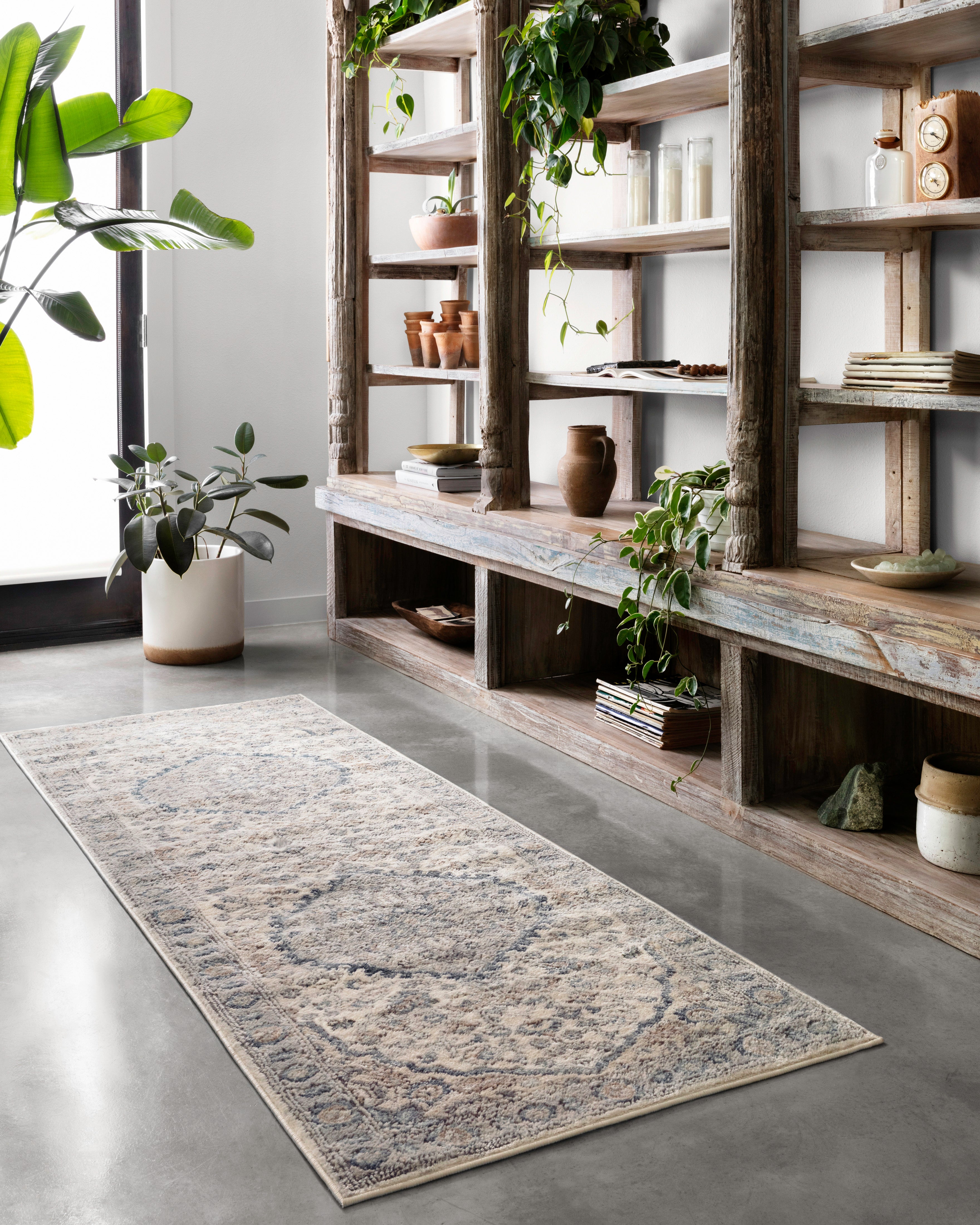 A power-loomed polypropylene and polyester area rug featuring contemporary design and warm natural and light grey tones, the Teagan TEA-01 Natural / Lt. Grey Area Rug adds character to any room