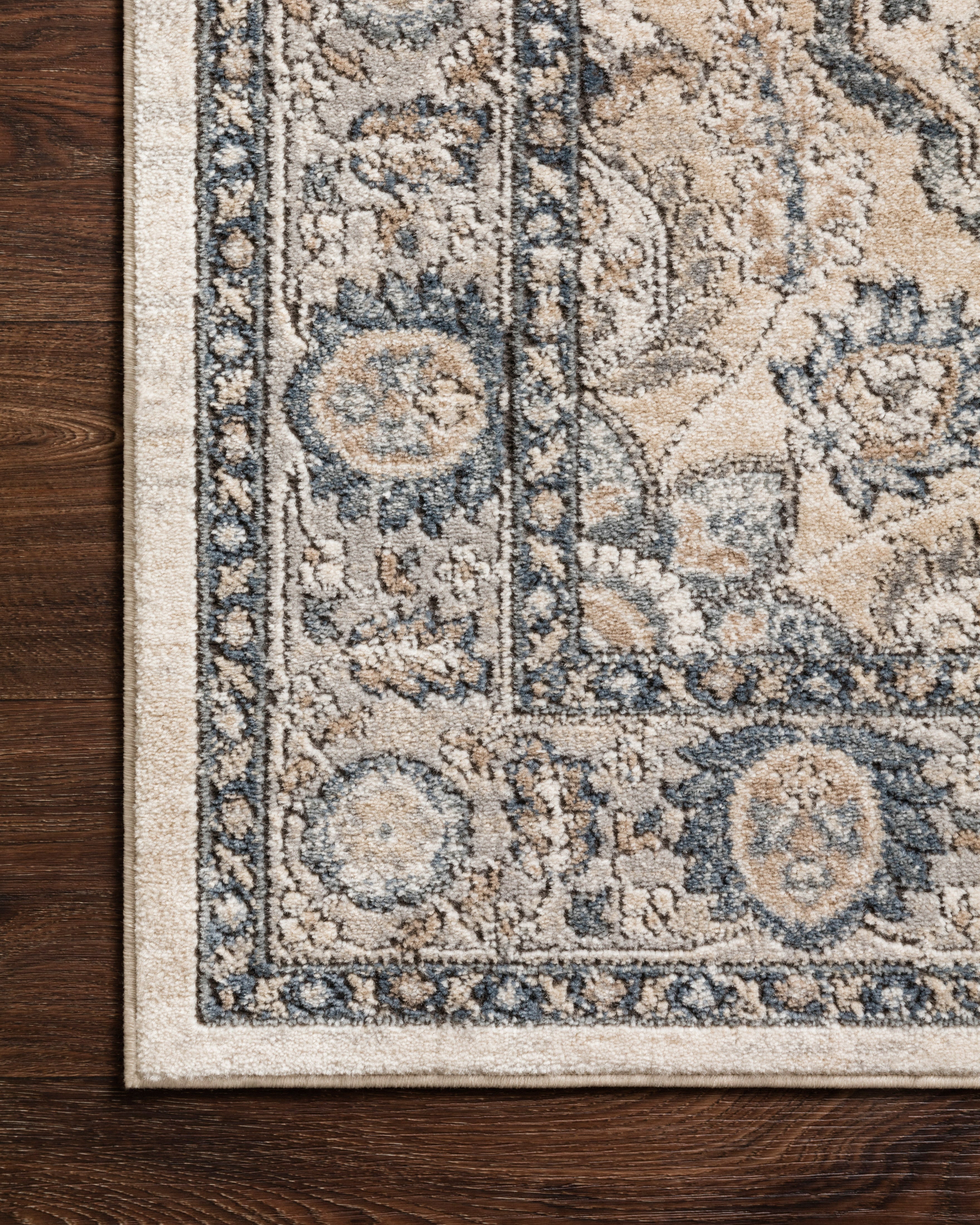A power-loomed polypropylene and polyester area rug featuring contemporary design and warm natural and light grey tones, the Teagan TEA-01 Natural / Lt. Grey Area Rug adds character to any room