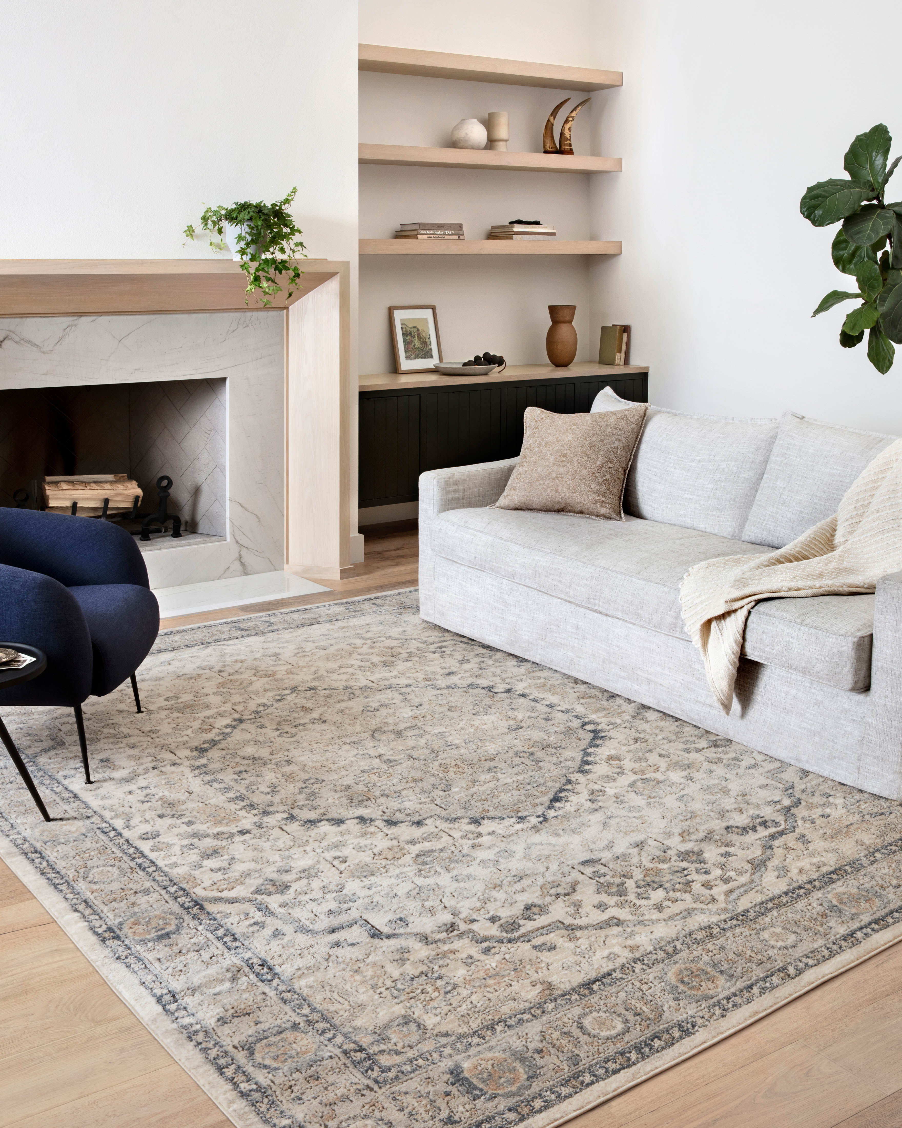 A power-loomed polypropylene and polyester area rug featuring contemporary design and warm natural and light grey tones, the Teagan TEA-01 Natural / Lt. Grey Area Rug adds character to any room