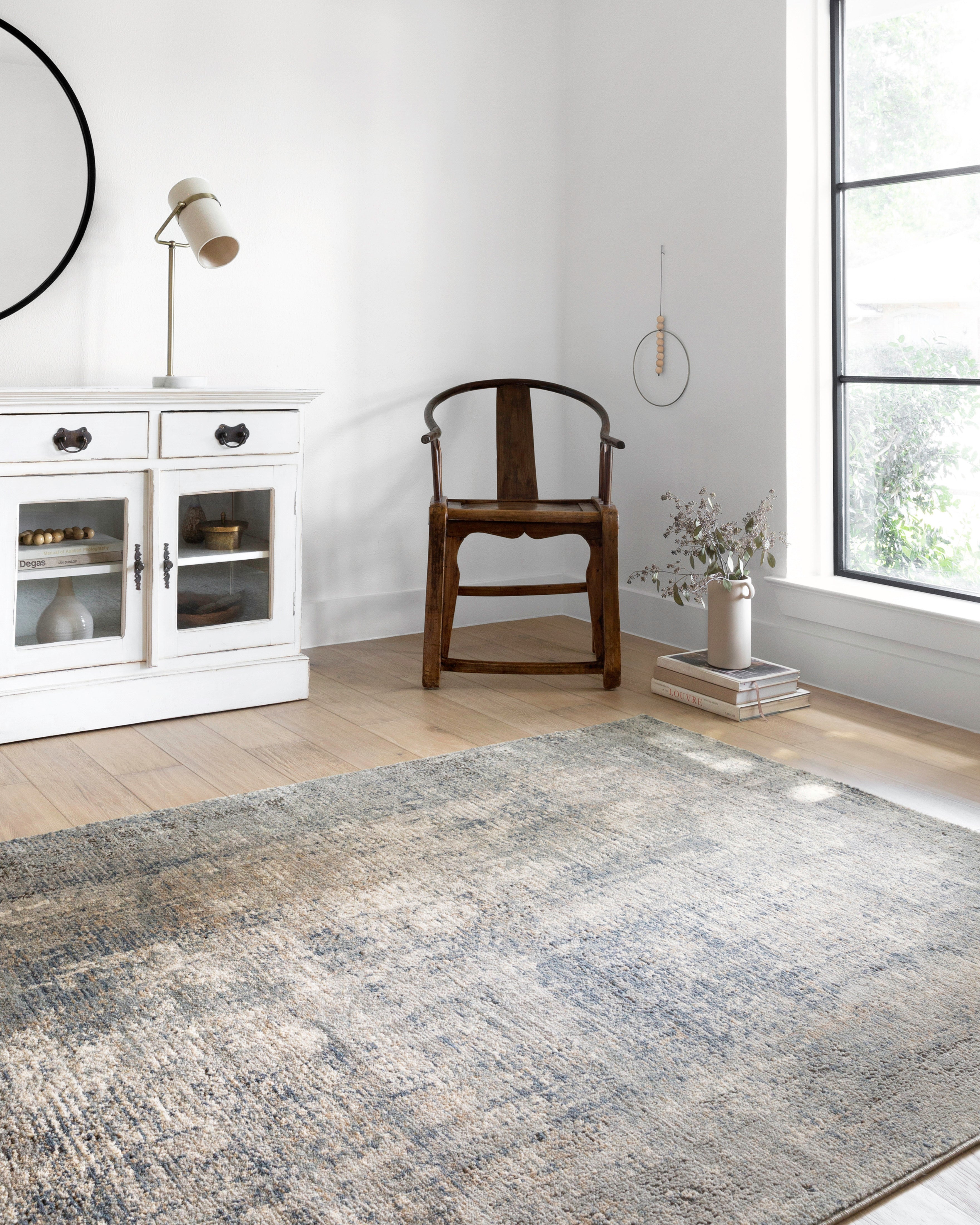 Finished in casual denim and cool slate tones with contemporary styling, the Teagan TEA-05 Denim / Slate Area Rug is a power-loomed polypropylene and polyester area rug for modern living