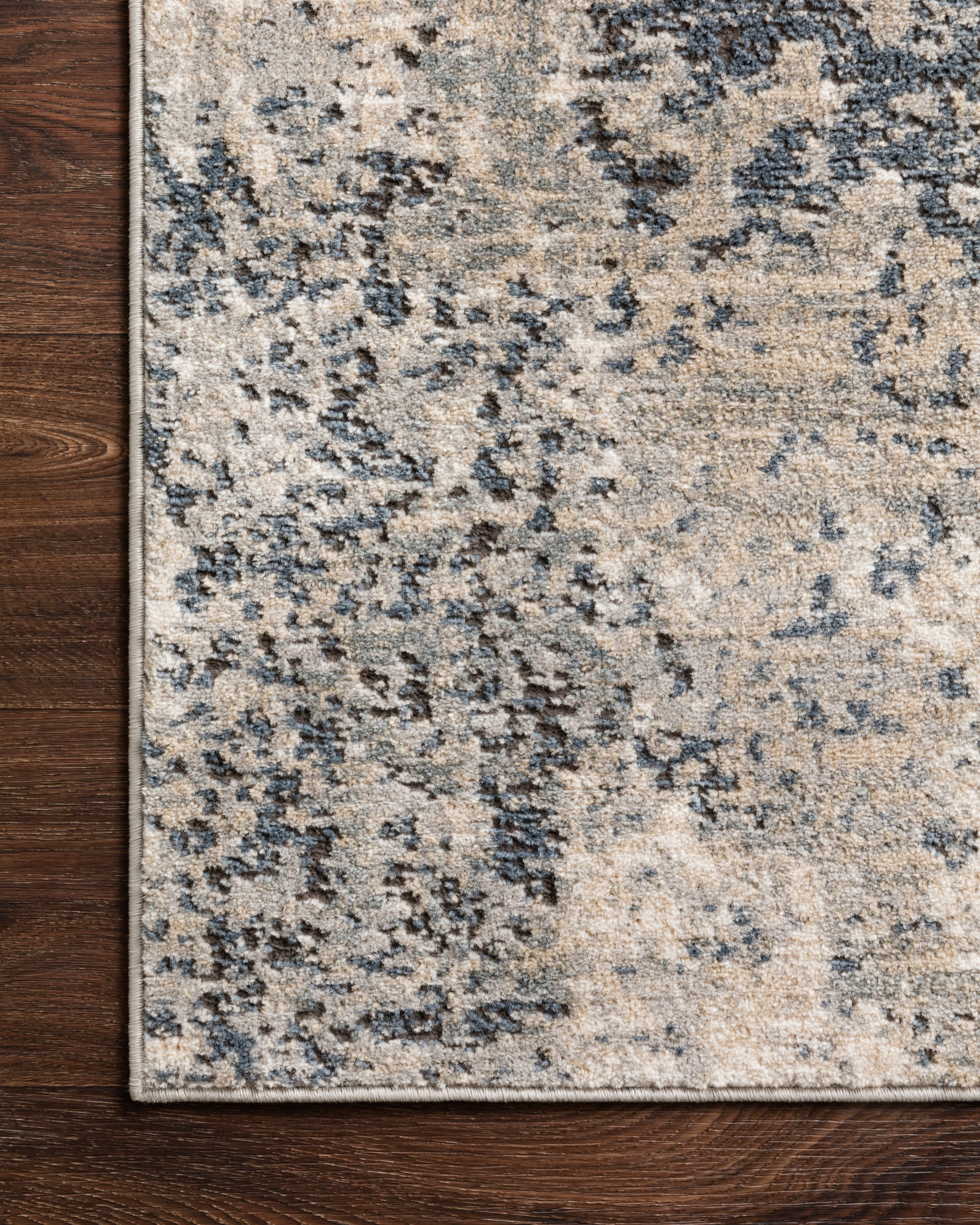 The Teagan TEA-07 Natural / Denim Area Rug highlights warm natural and casual denim tones and contemporary texture in a beautifully made power-loomed polypropylene and polyester area rug