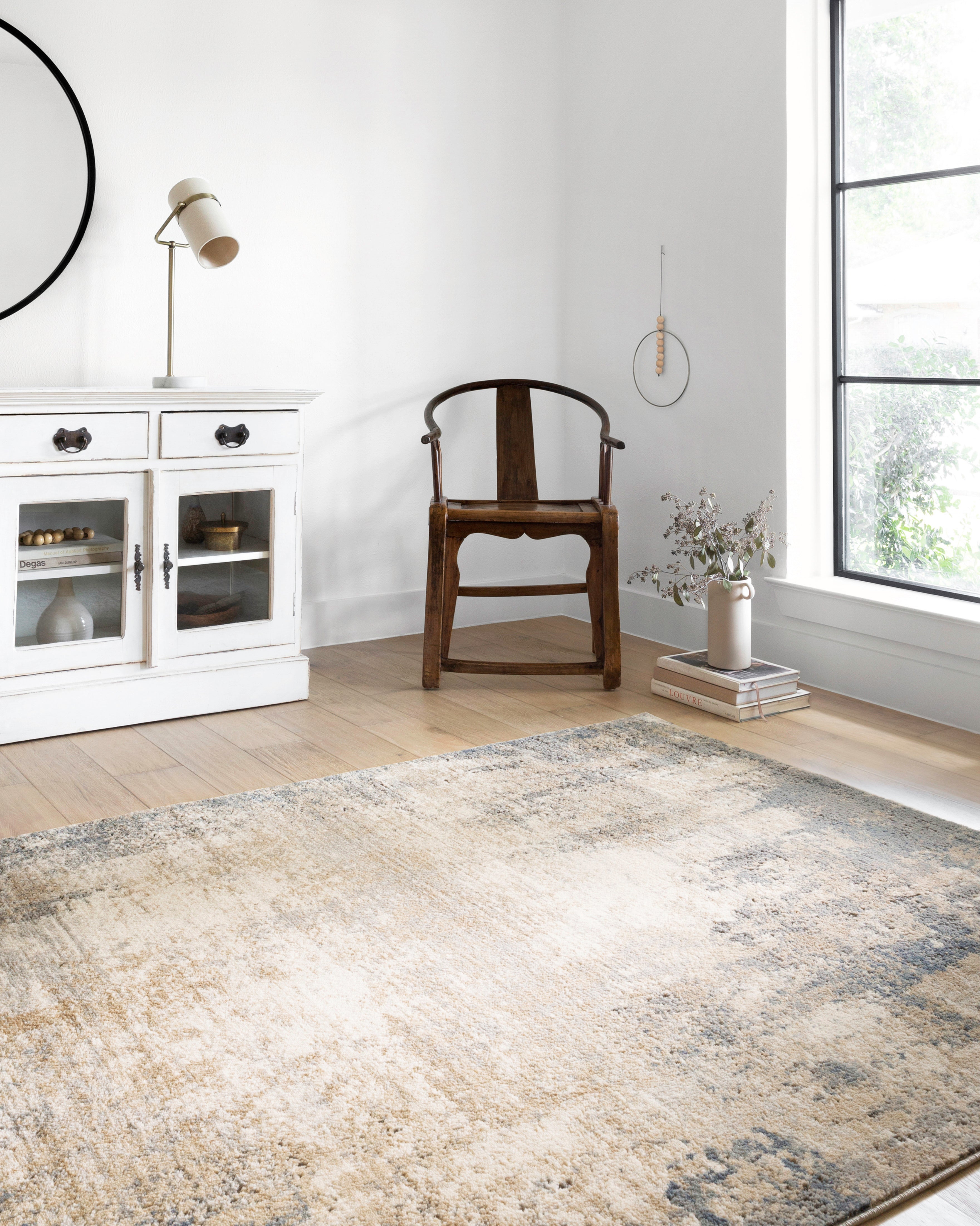 Dressed in refined ivory and soft misty hues with contemporary detail, the Teagan TEA-08 Ivory / Mist Area Rug is a power-loomed polypropylene and polyester area rug that completes any room
