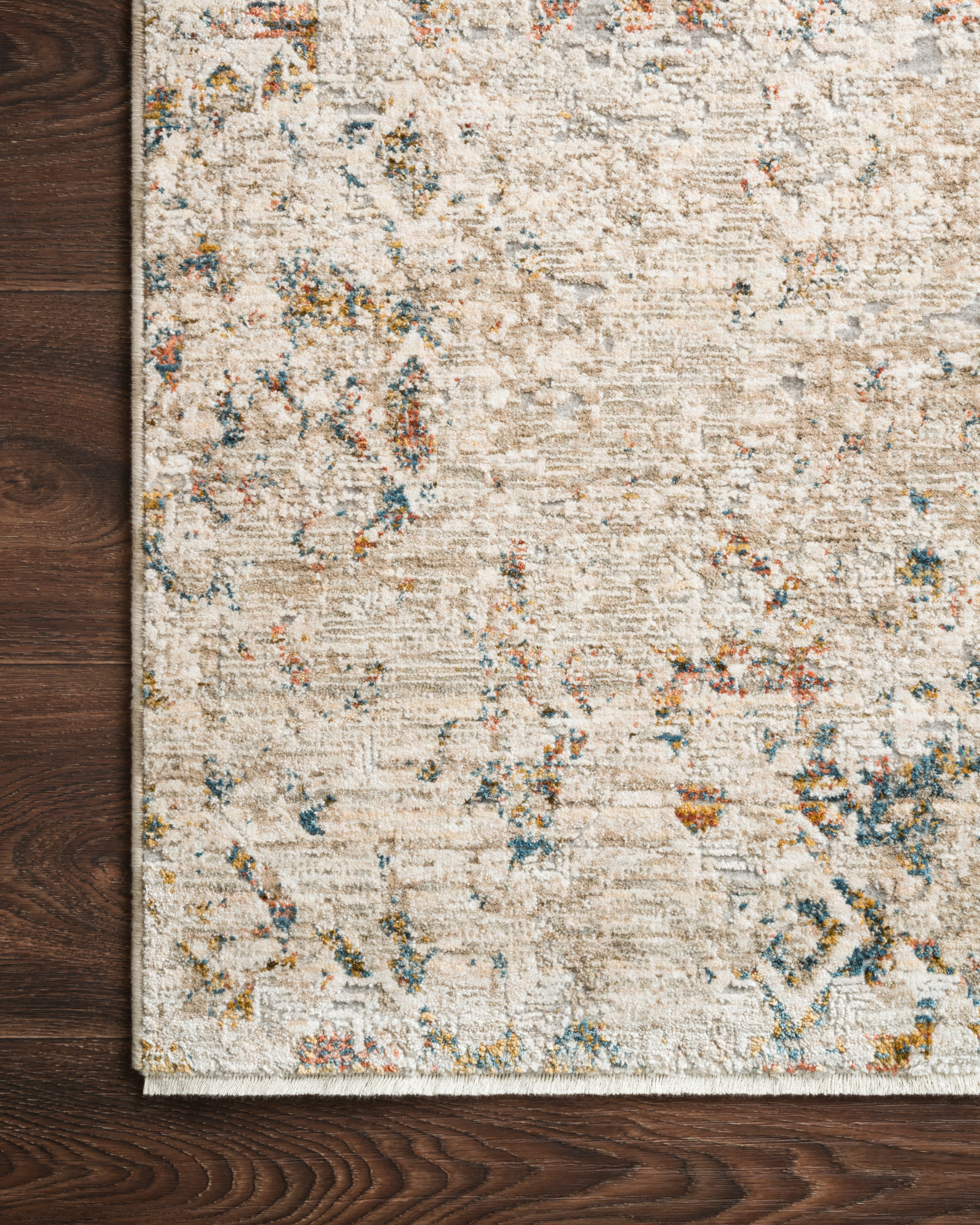 Layered in vibrant multi-toned and warm natural hues, the Theia THE-04 Multi / Natural Area Rug is a power-loomed polyester pile and rayon area rug perfect for any setting
