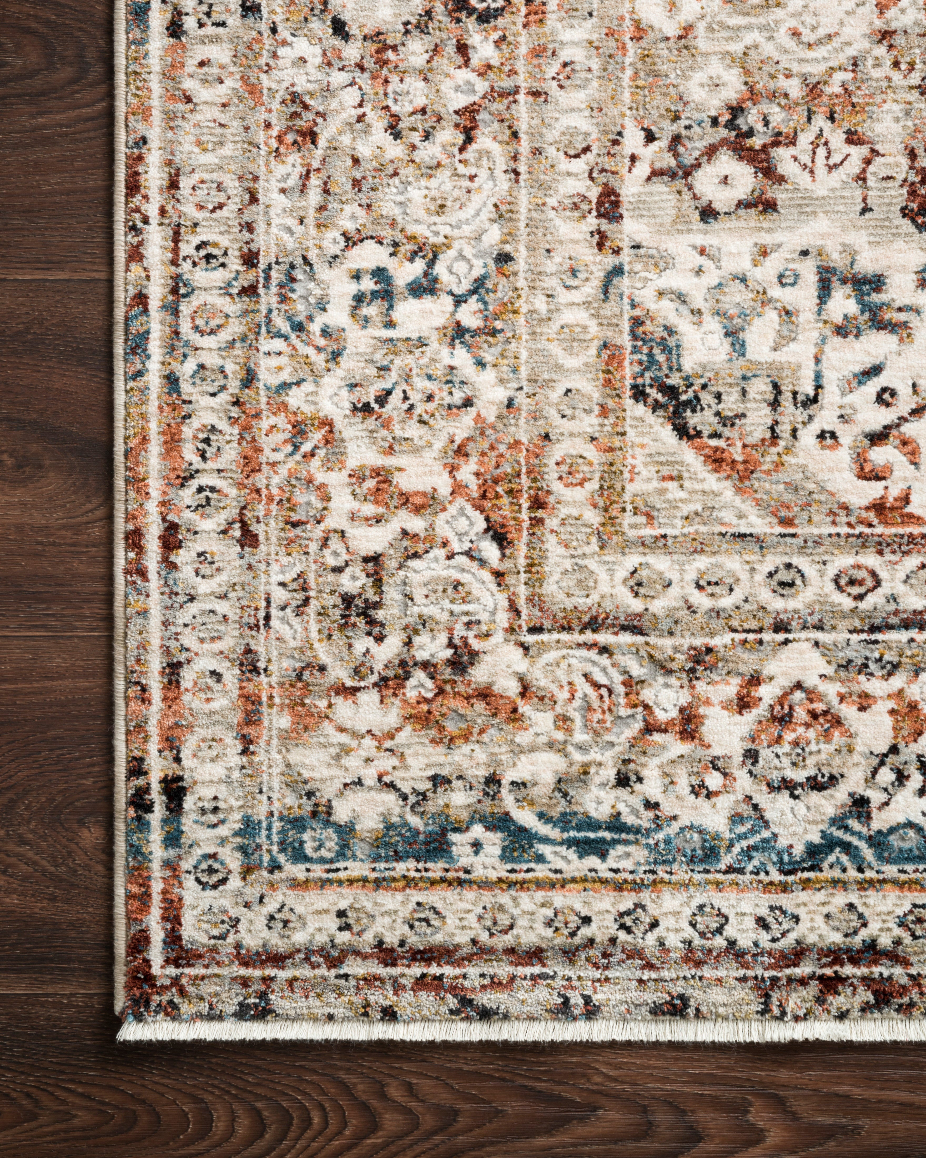 The Theia THE-05 Taupe / Brick Area Rug showcases versatile taupe and rich brick tones in a power-loomed polyester pile and rayon area rug