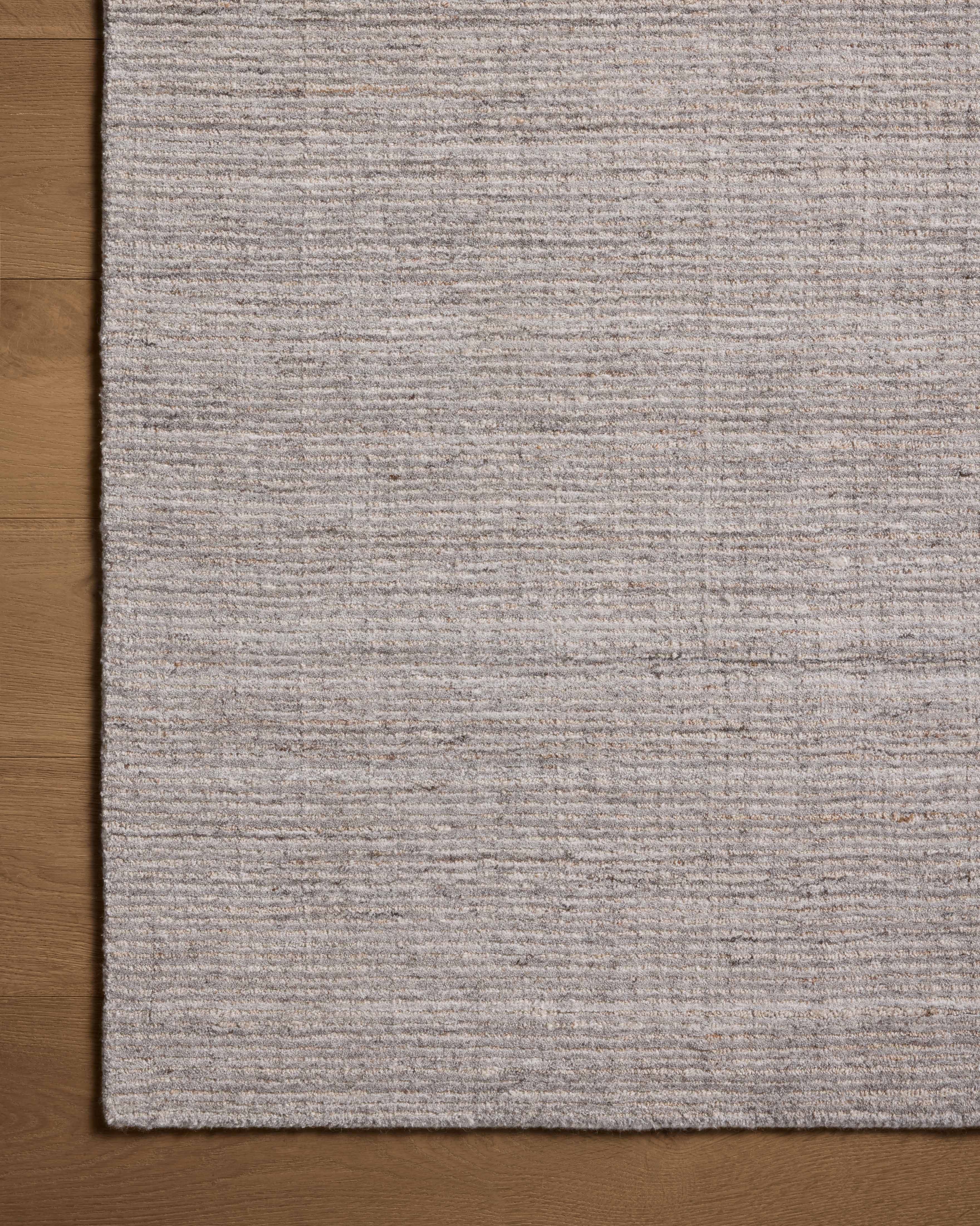 The Thorne THT-01 Grey Area Rug delivers elegant grey beauty in a hand-loomed polyester area rug