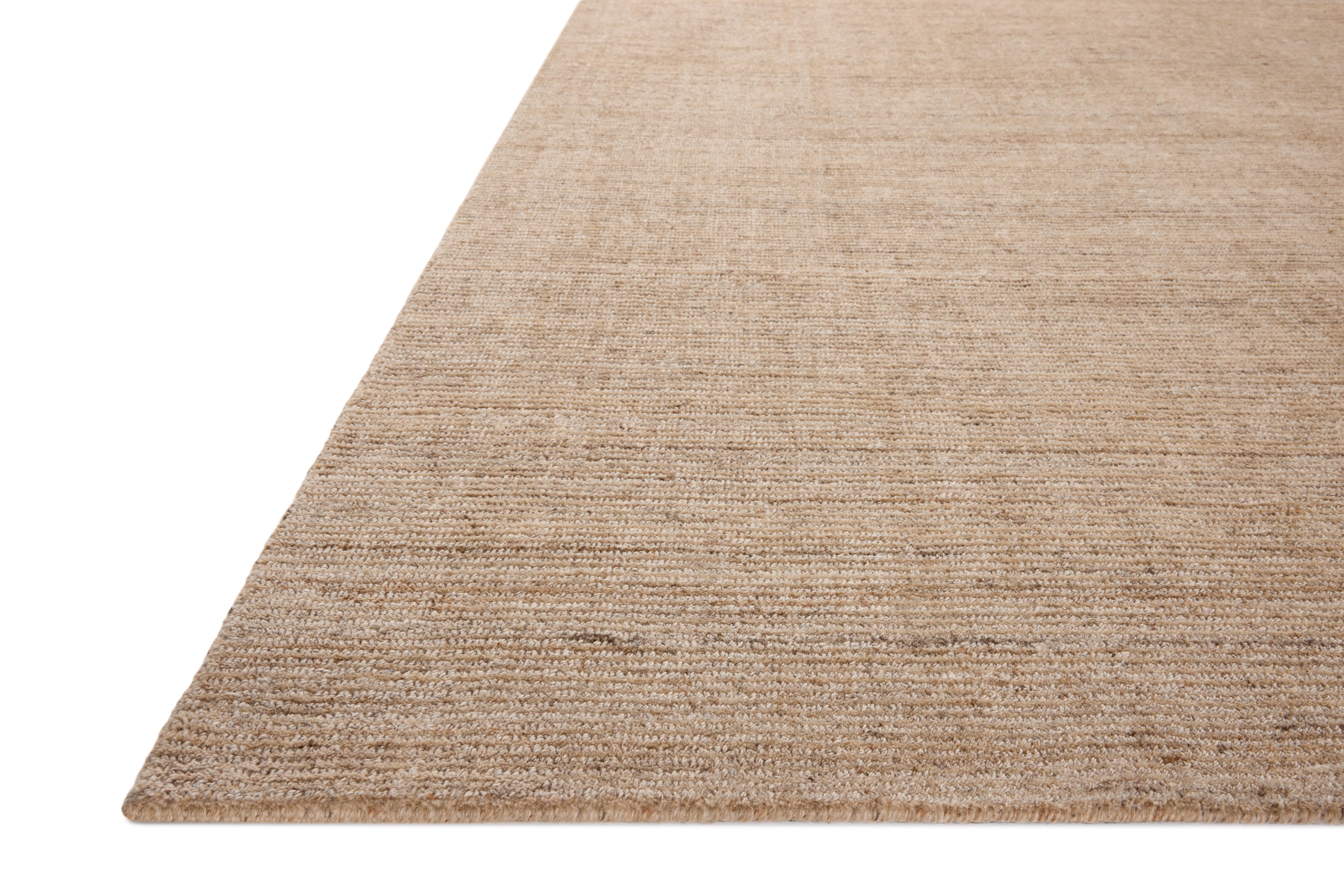 The Thorne THT-01 Sand Area Rug combines sandy tones with a hand-loomed polyester area rug for effortless elegance