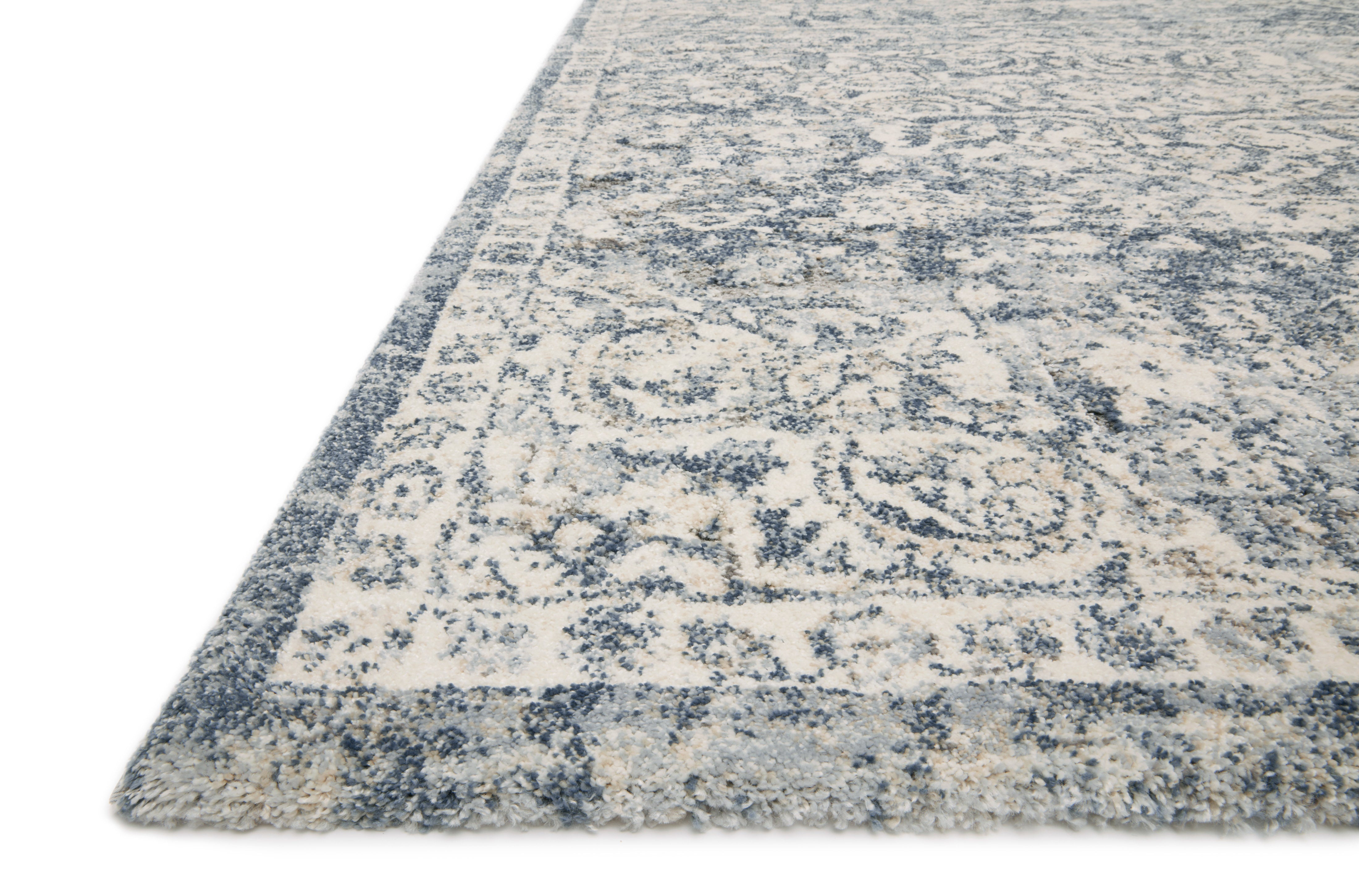 With refined ivory and calming blue hues and transitional styling, the Theory THY-02 Ivory / Blue Area Rug is a power-loomed polypropylene and polyester area rug that elevates any room