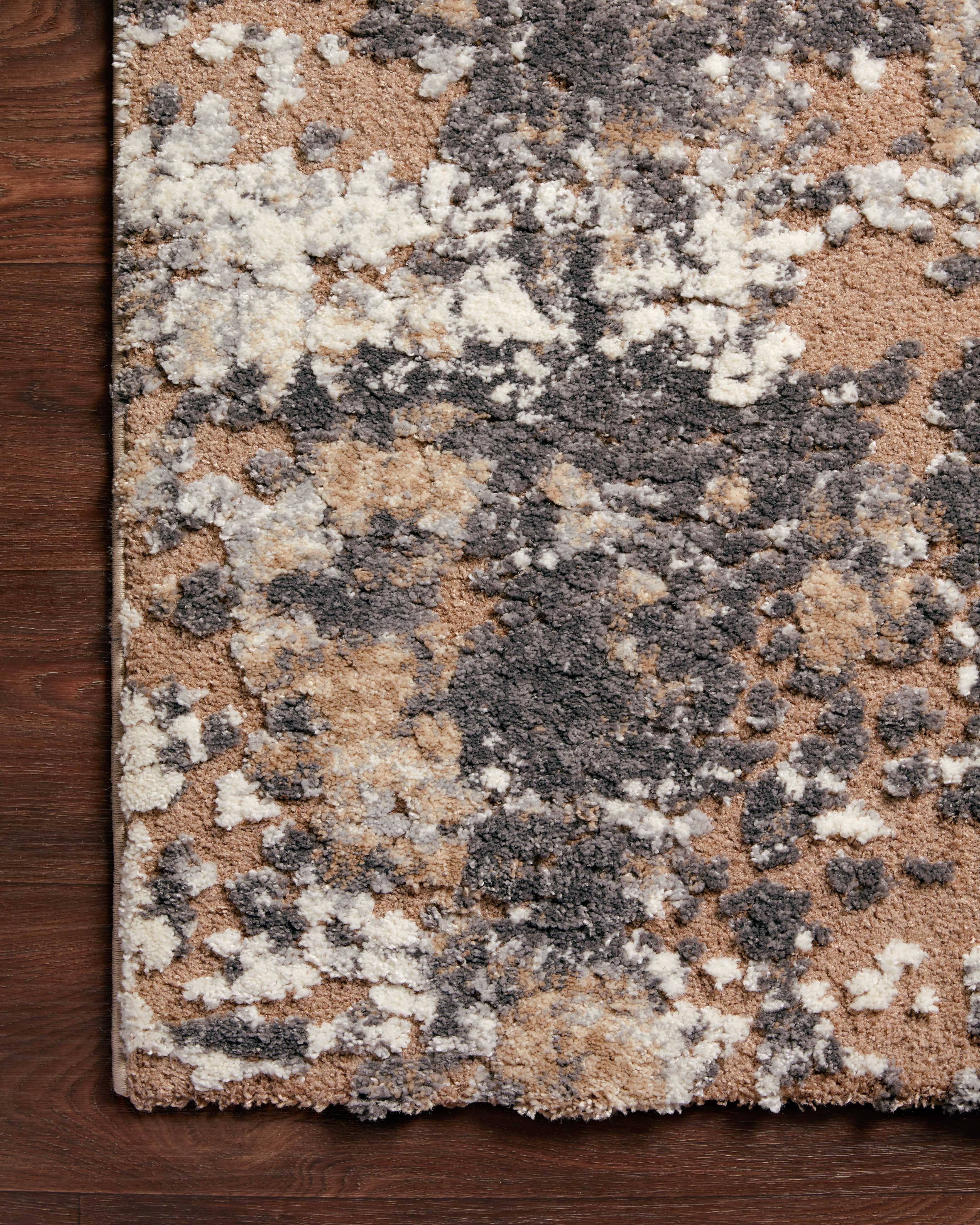 A stunning power-loomed polypropylene and polyester area rug with transitional detail, the Theory THY-04 Taupe / Grey Area Rug features versatile taupe and elegant grey tones for a polished look