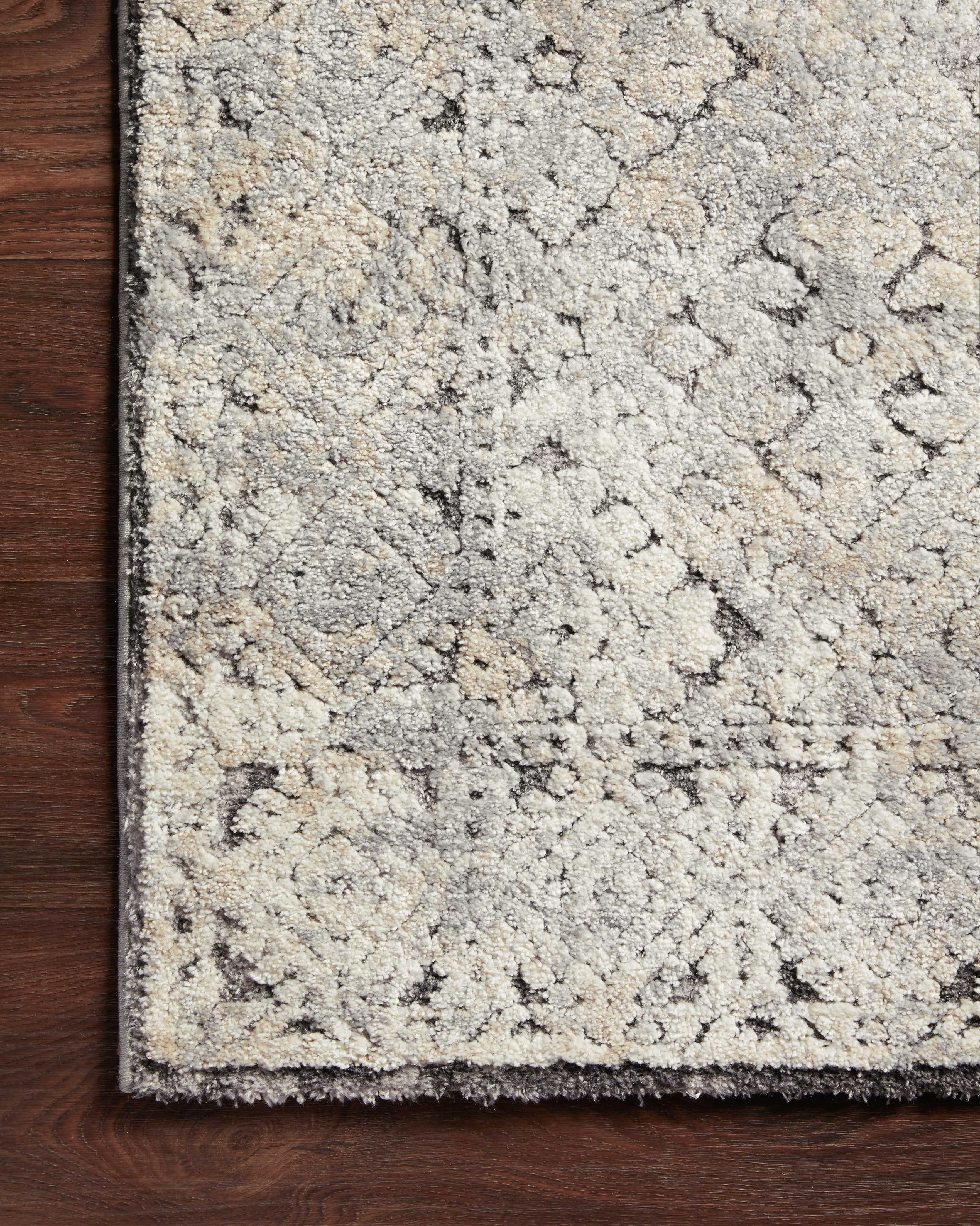 The Theory THY-05 Grey / Sand Area Rug delivers elegant grey and sandy beauty and transitional elegance in a power-loomed polypropylene and polyester area rug