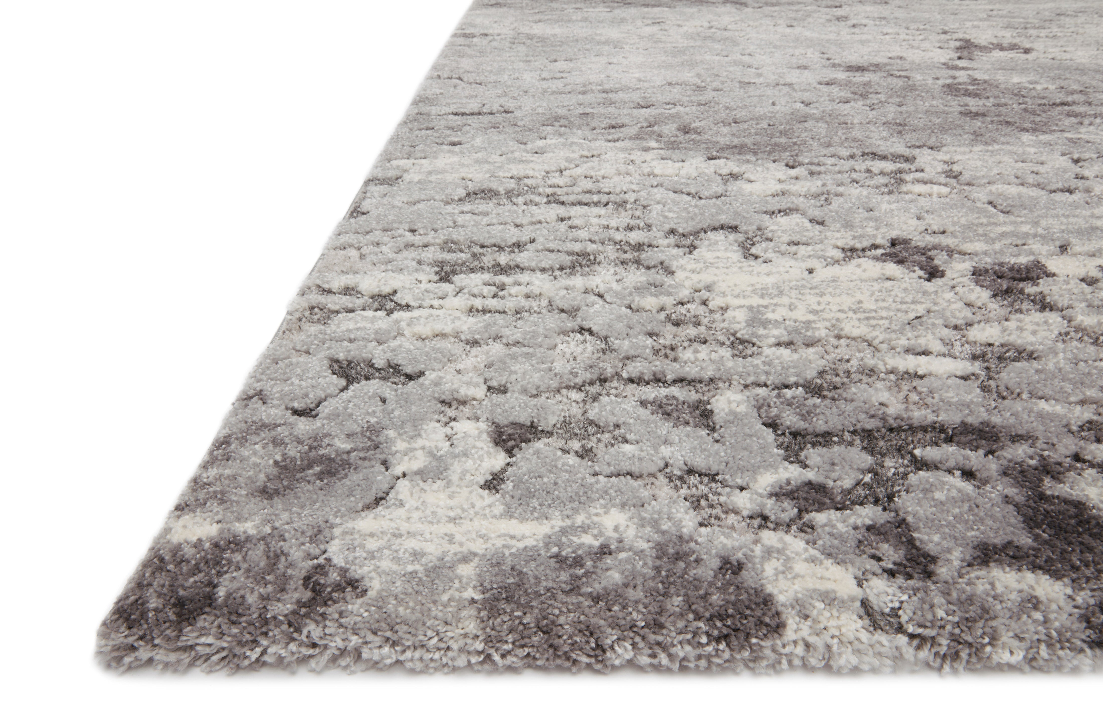 A power-loomed polypropylene and polyester area rug featuring transitional design and deep charcoal and elegant grey tones, the Theory THY-08 Charcoal / Grey Area Rug adds character to any room