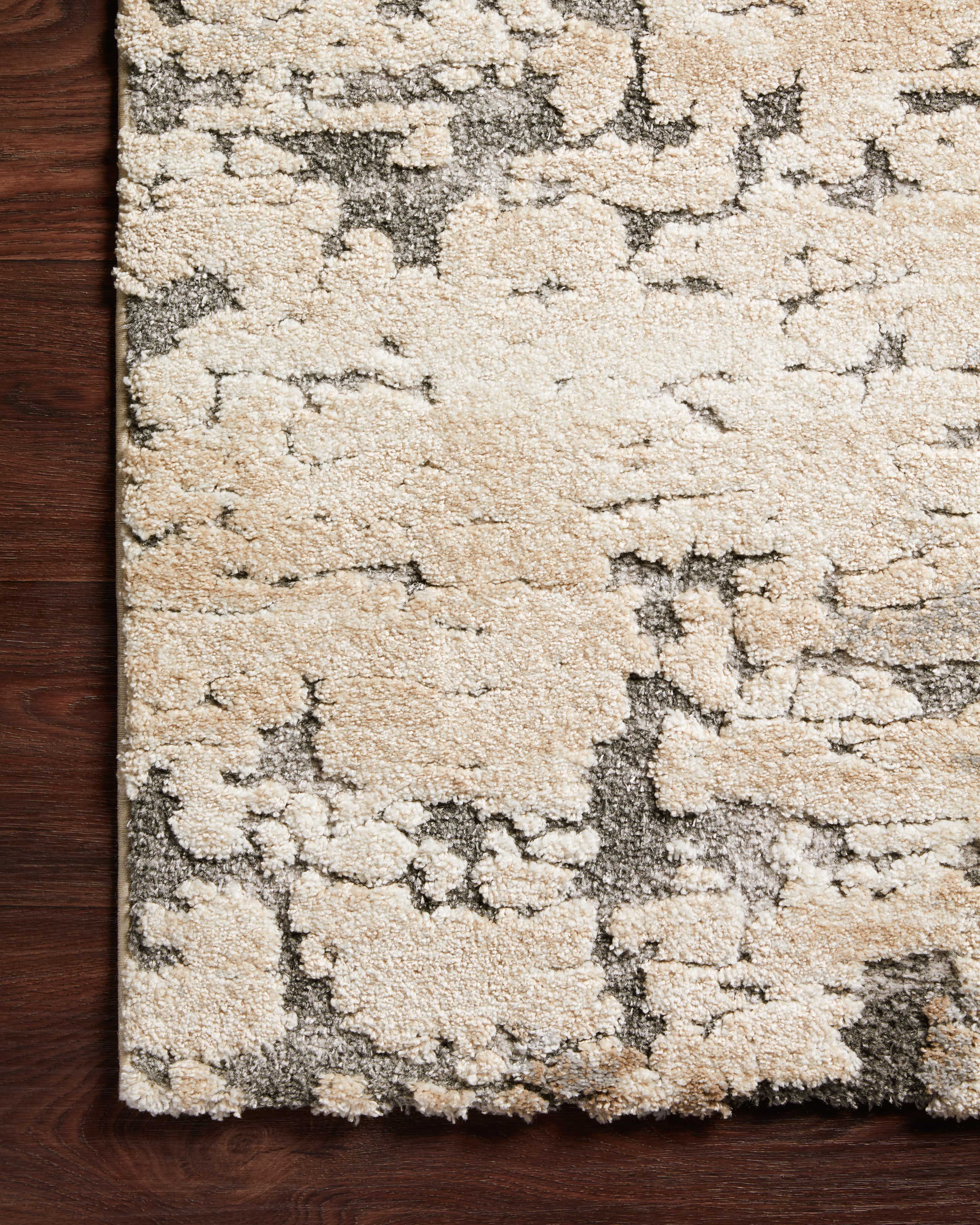 Rich in versatile taupe and elegant grey hues with transitional detail, the Theory THY-08 Taupe / Grey Area Rug is a power-loomed polypropylene and polyester area rug built for style and comfort