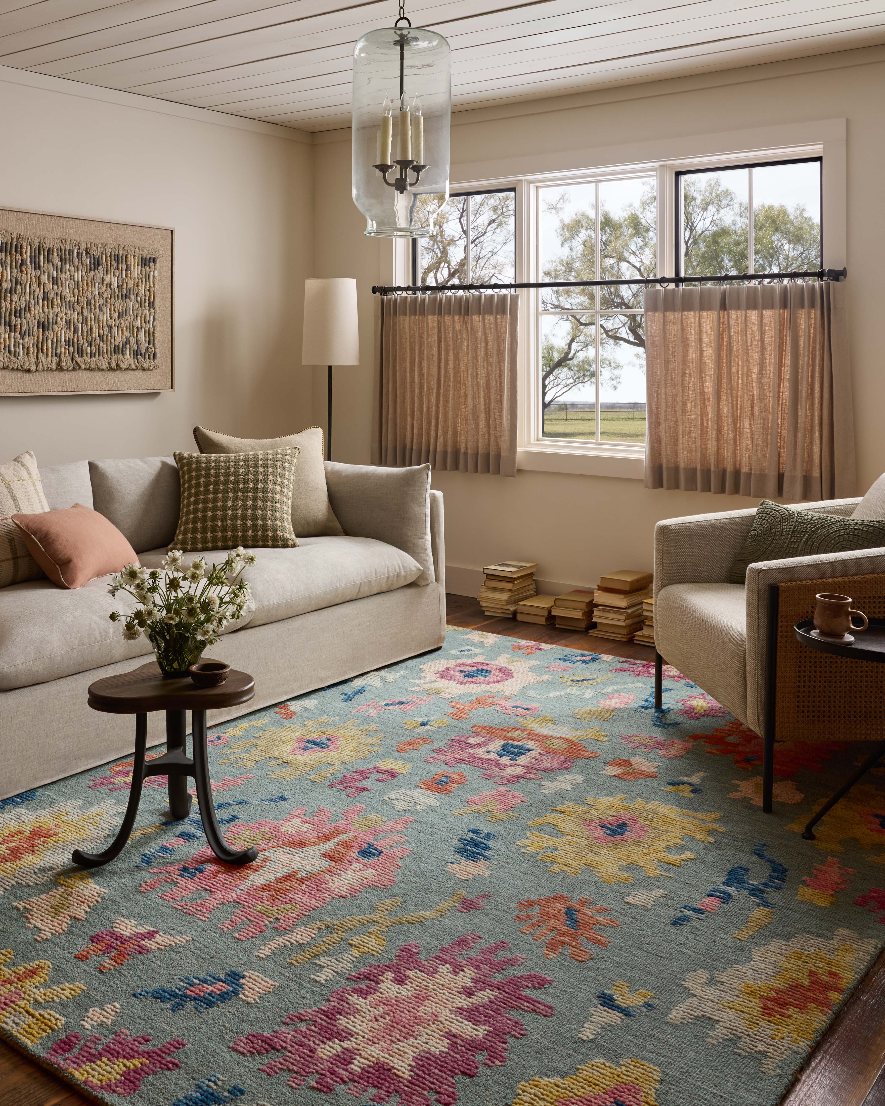 A hand-tufted wool area rug with floral and high-low textured flair in spa and vibrant multi-toned tones, the Tilly TIL-01 Spa / Multi Area Rug anchors any room