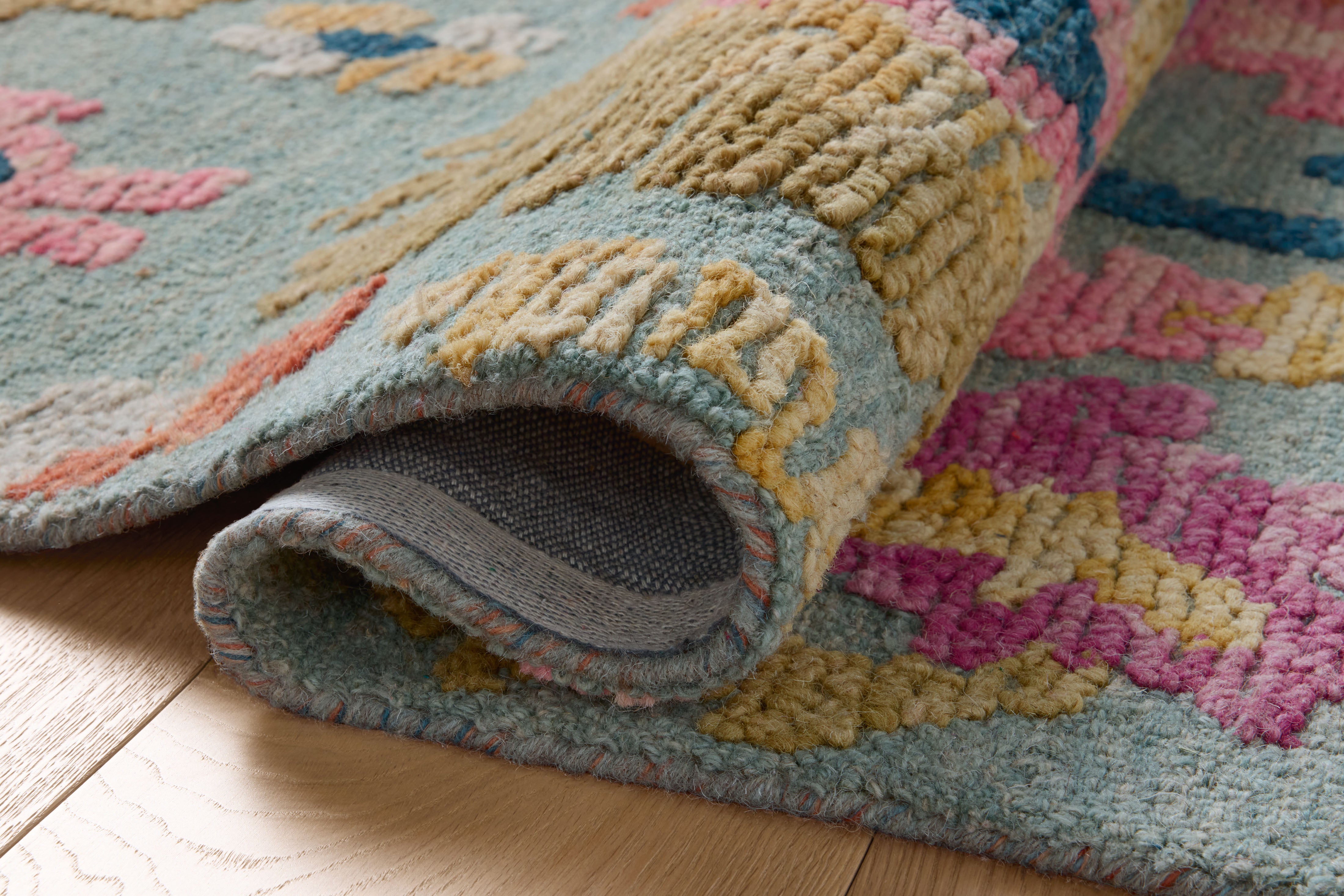 A hand-tufted wool area rug with floral and high-low textured flair in spa and vibrant multi-toned tones, the Tilly TIL-01 Spa / Multi Area Rug anchors any room