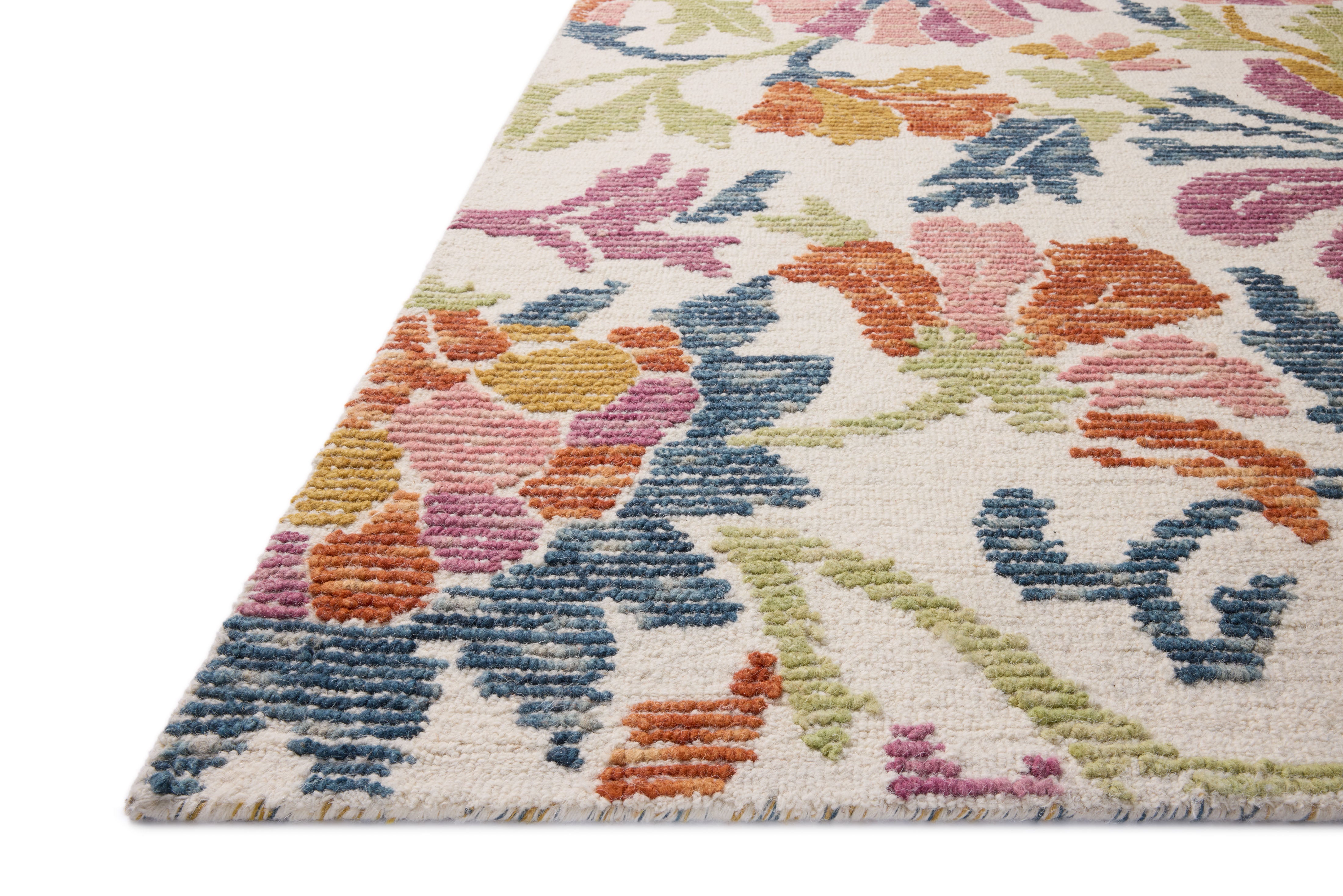 The Tilly TIL-02 Ivory / Multi Area Rug pairs refined ivory and vibrant multi-toned tones and floral and high-low textured patterns in a hand-tufted wool area rug