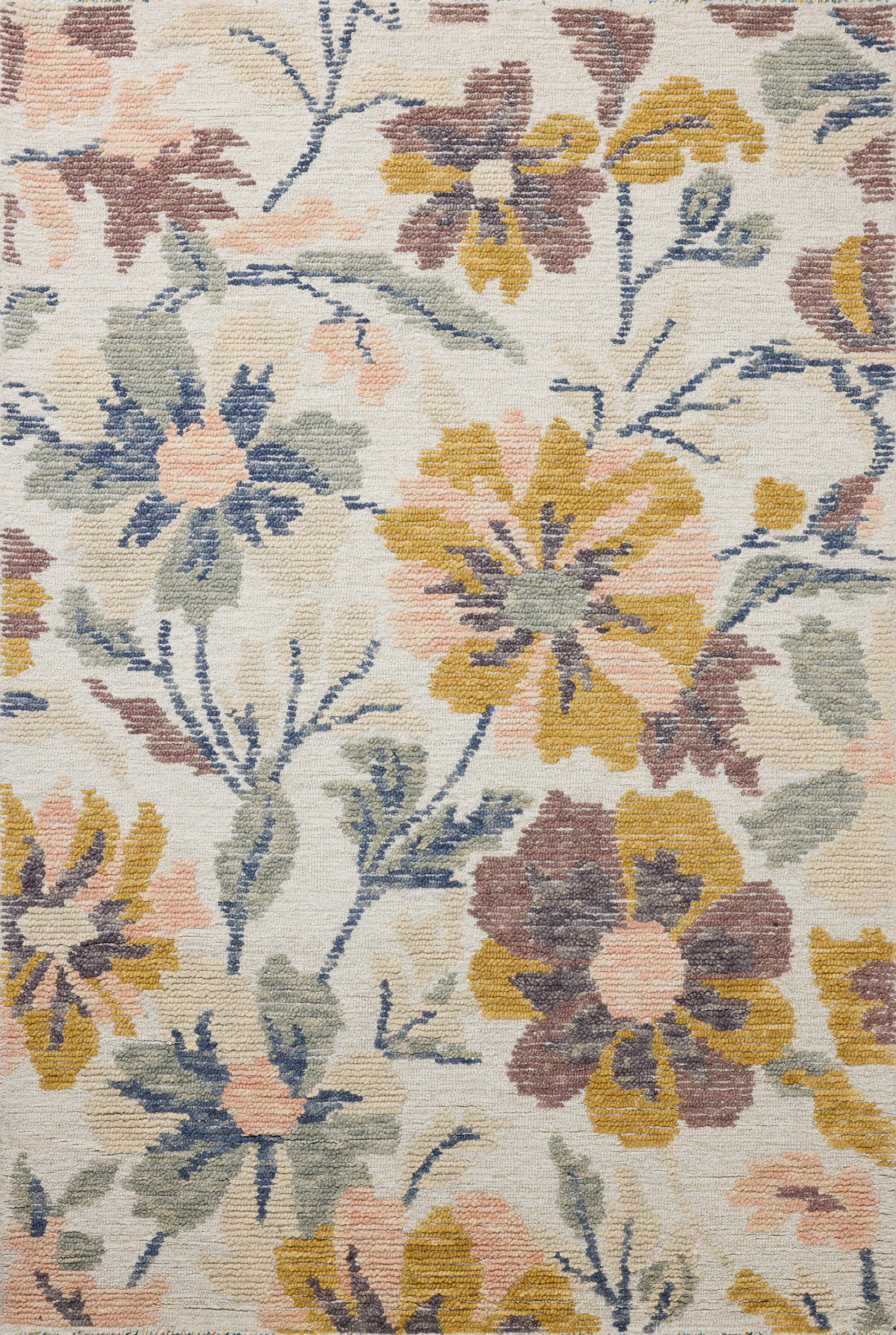 Crafted as a hand-tufted wool area rug, the Tilly TIL-03 Bone / Multi Area Rug brings bone and vibrant multi-toned warmth and floral and high-low textured character to your space