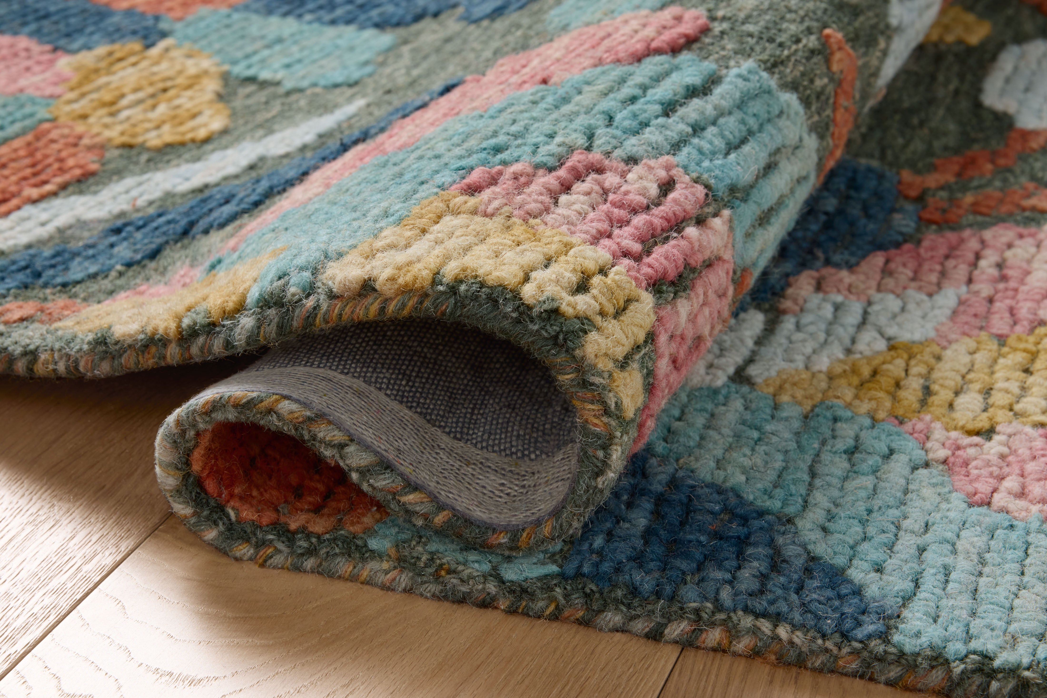 The Tilly TIL-05 Green / Multi Area Rug blends green and vibrant multi-toned tones and floral and high-low textured motifs into a hand-tufted wool area rug with timeless appeal