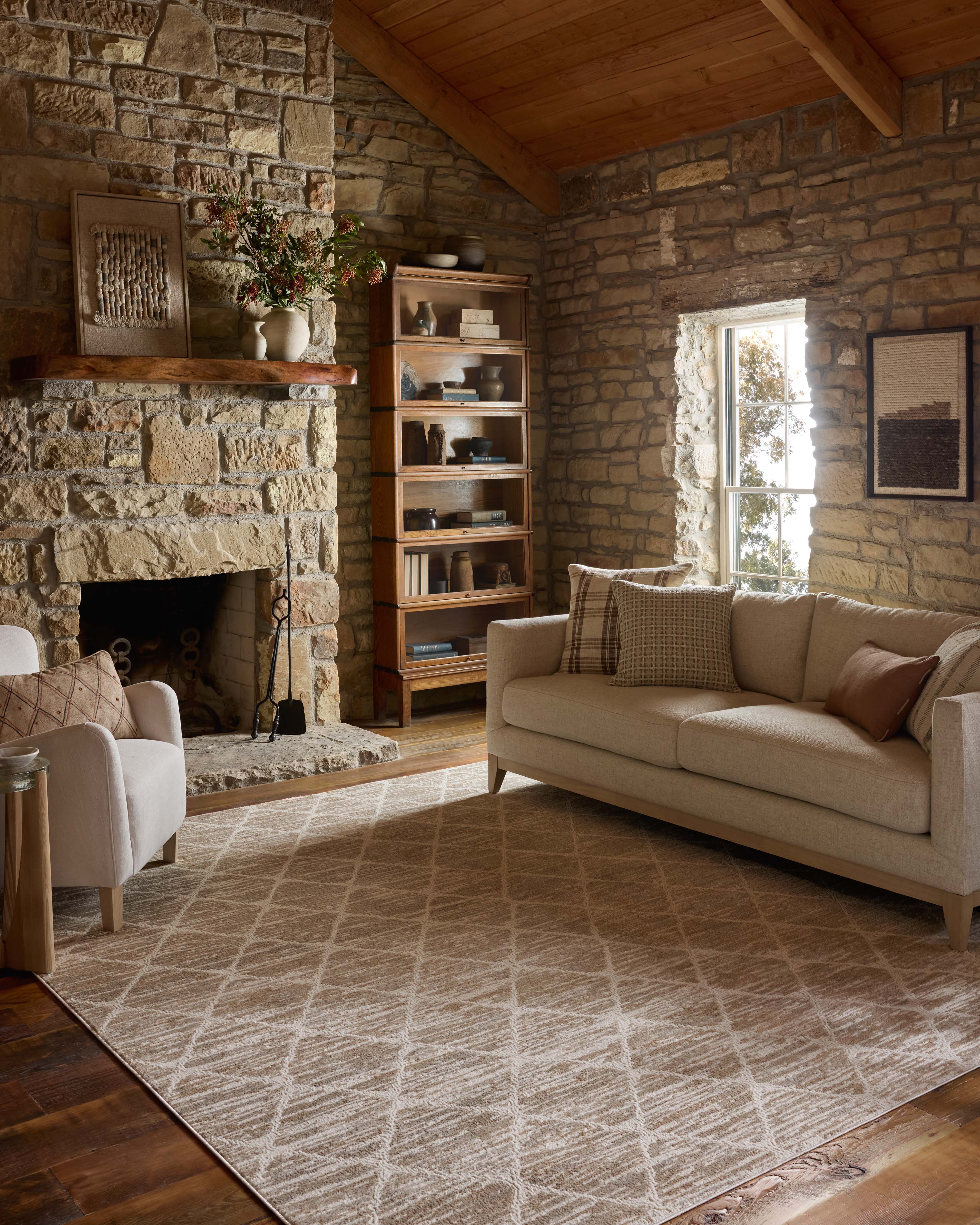 A stunning power-loomed polyester area rug with abstract detail, the Townes TOW-01 Pebble / Beige Area Rug features subtle pebble and warm beige tones for a polished look