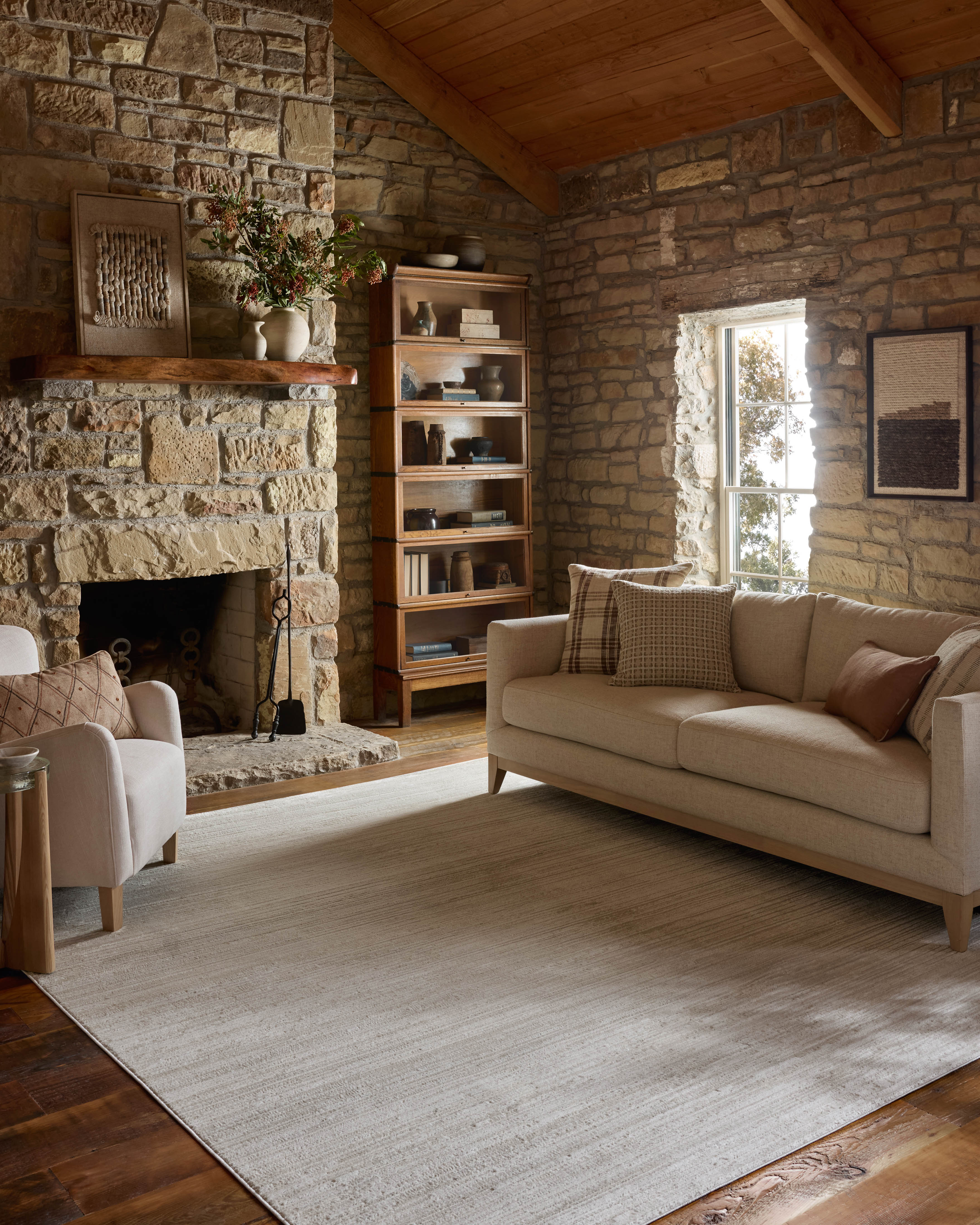 The Townes TOW-02 Beige / Ivory Area Rug delivers warm beige and refined ivory beauty and abstract elegance in a power-loomed polyester area rug