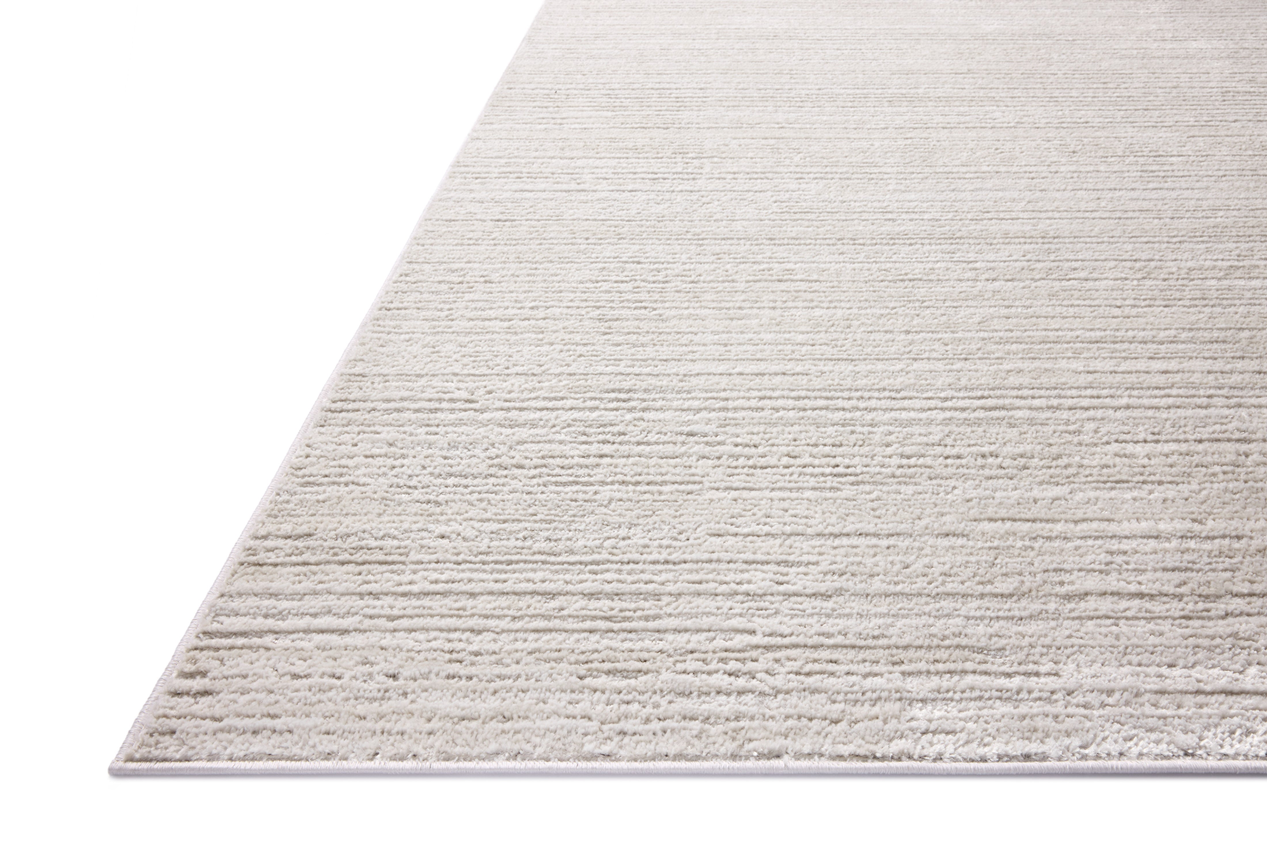 The Townes TOW-02 Beige / Ivory Area Rug delivers warm beige and refined ivory beauty and abstract elegance in a power-loomed polyester area rug