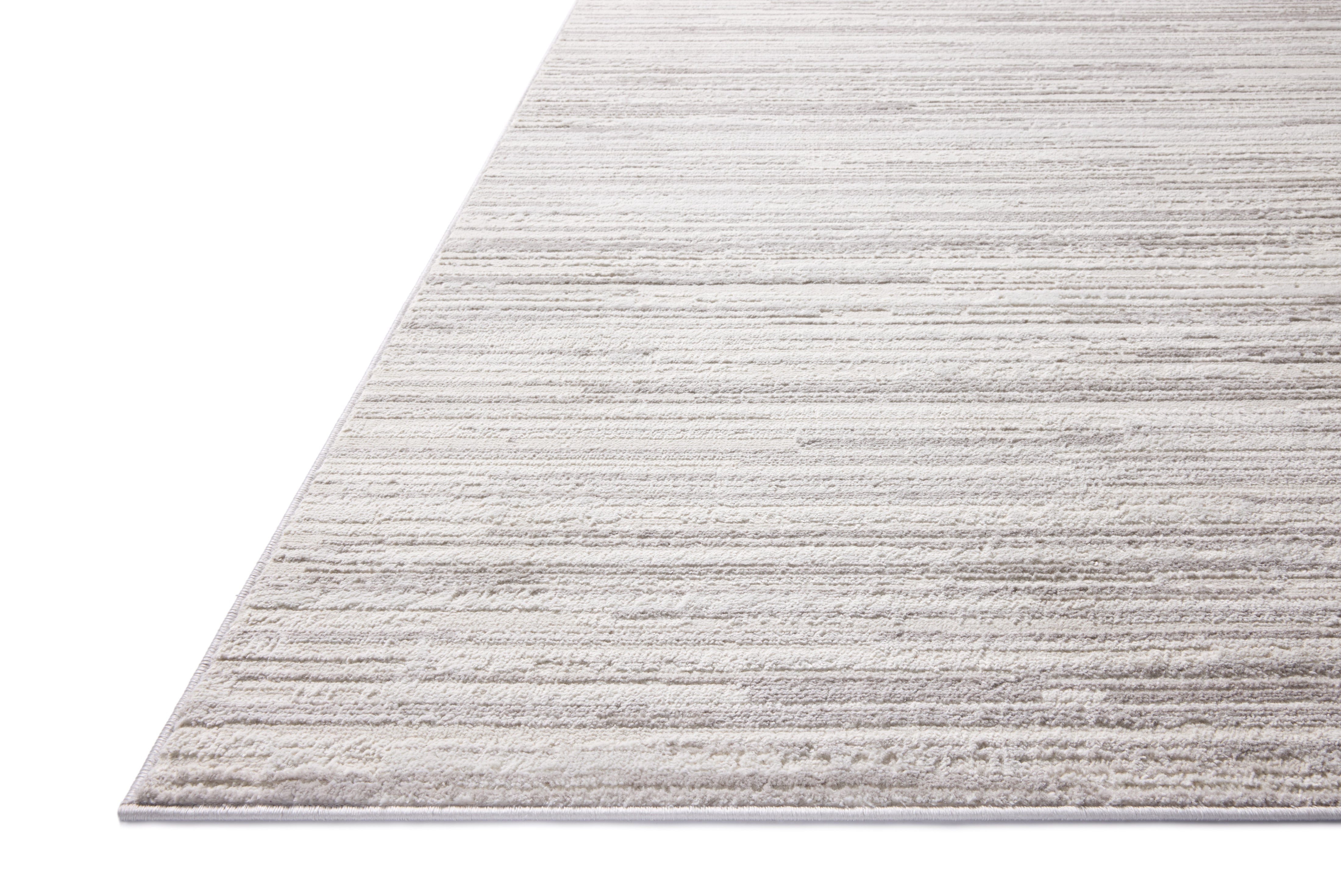 A power-loomed polyester area rug featuring abstract design and warm beige and elegant grey tones, the Townes TOW-05 Beige / Grey Area Rug adds character to any room