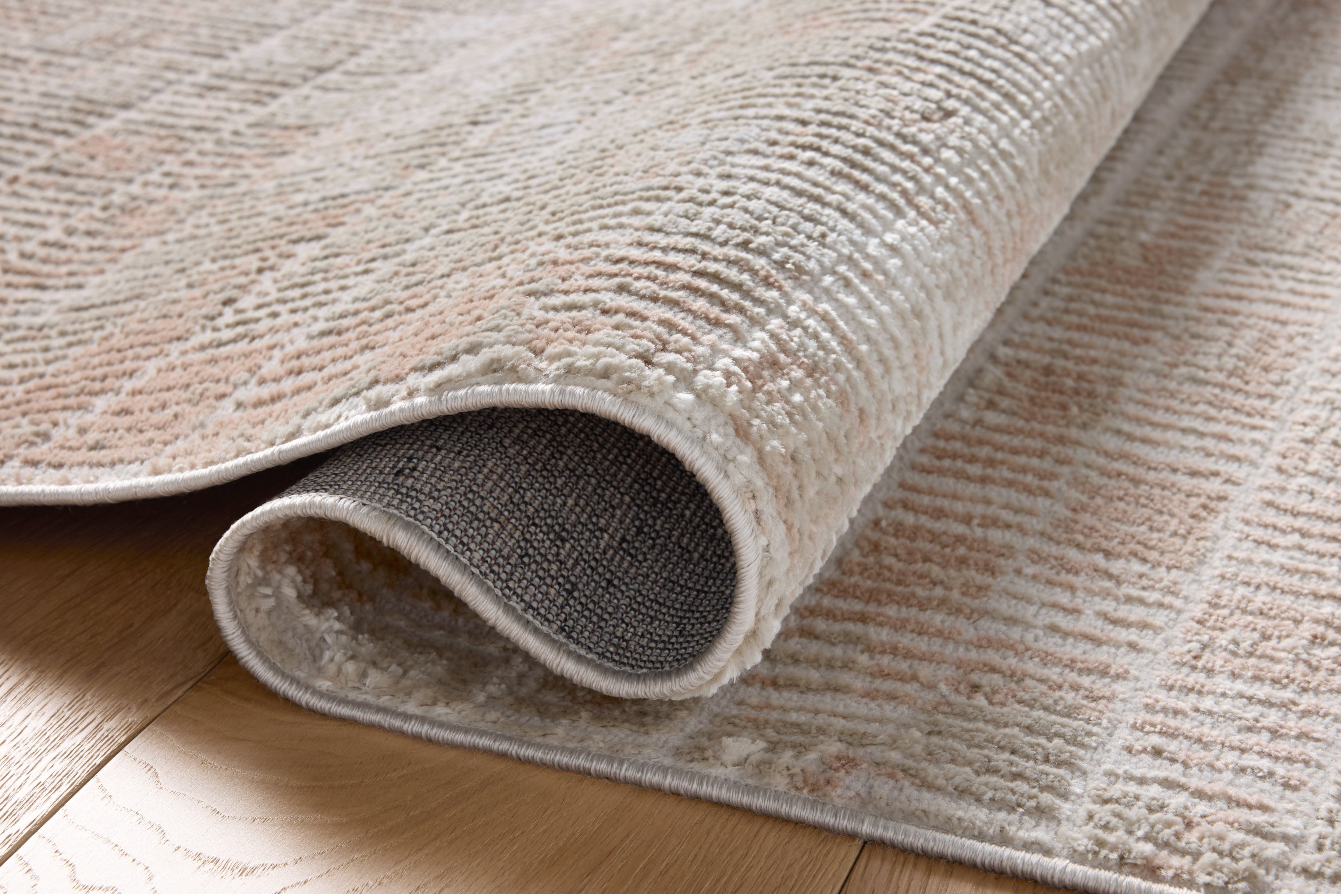 Rich in warm beige and earthy clay hues with abstract detail, the Townes TOW-06 Beige / Clay Area Rug is a power-loomed polyester area rug built for style and comfort