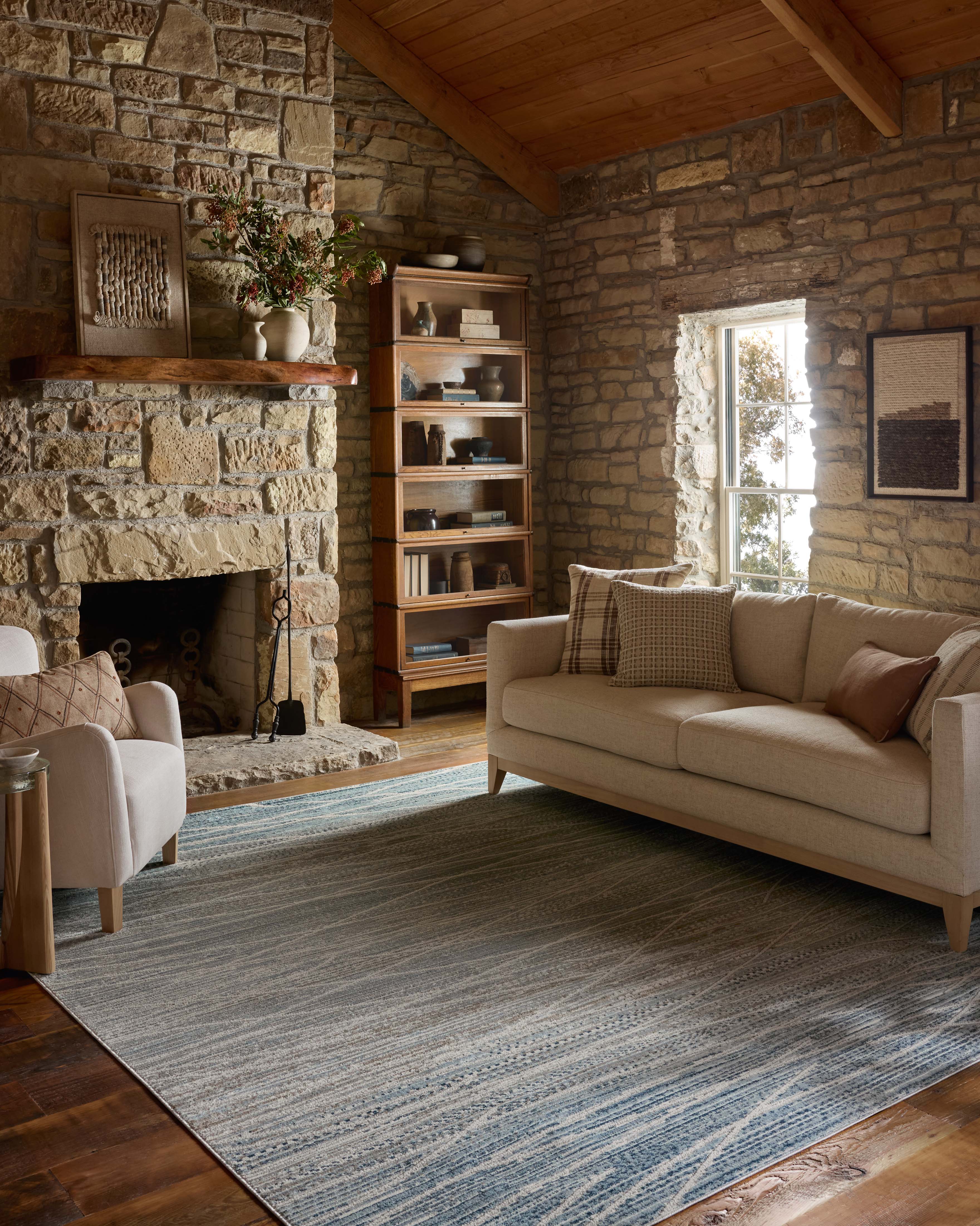 The Townes TOW-07 Natural / Sky Area Rug offers warm natural and breezy sky-blue sophistication and abstract charm in a power-loomed polyester area rug