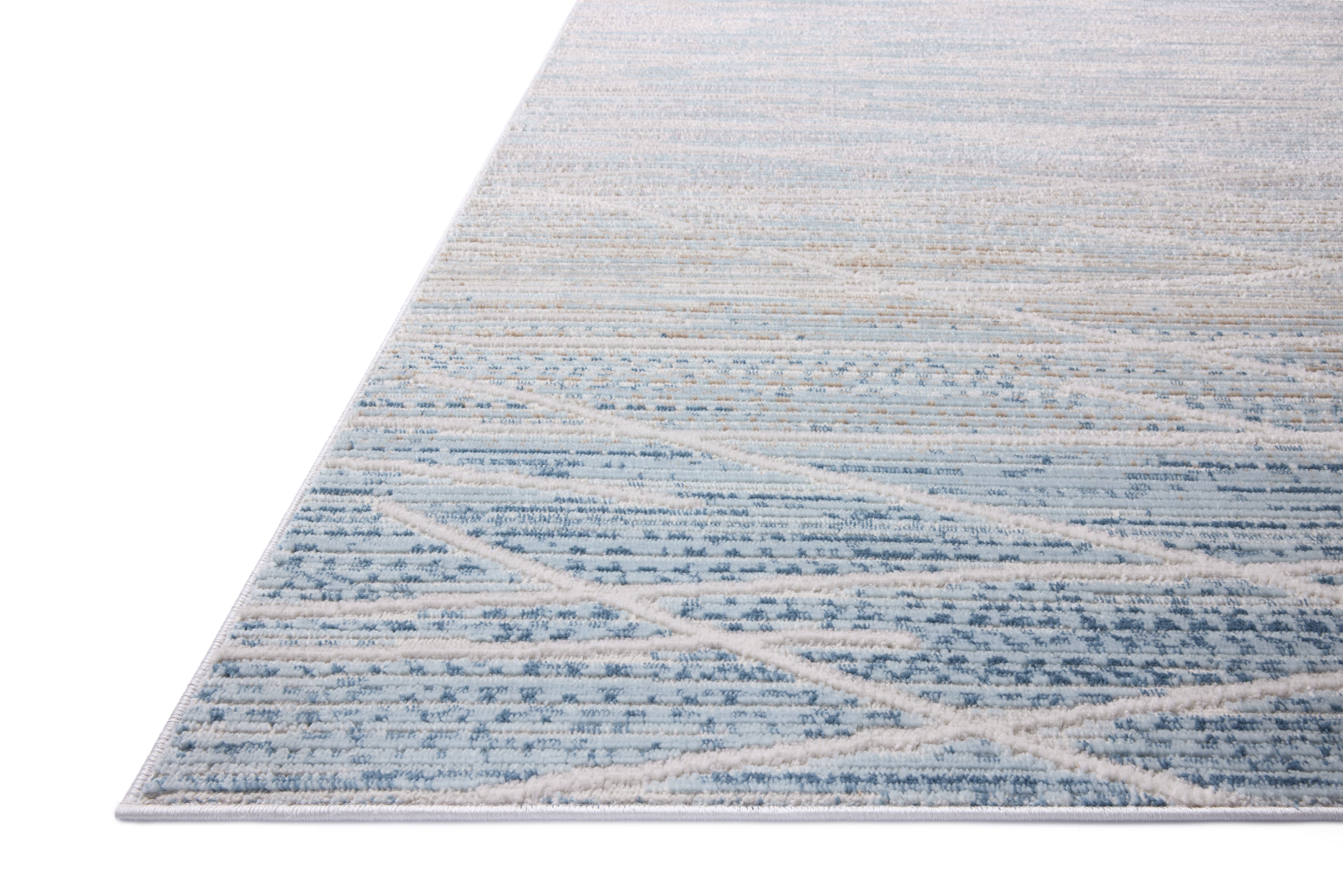 The Townes TOW-07 Natural / Sky Area Rug offers warm natural and breezy sky-blue sophistication and abstract charm in a power-loomed polyester area rug