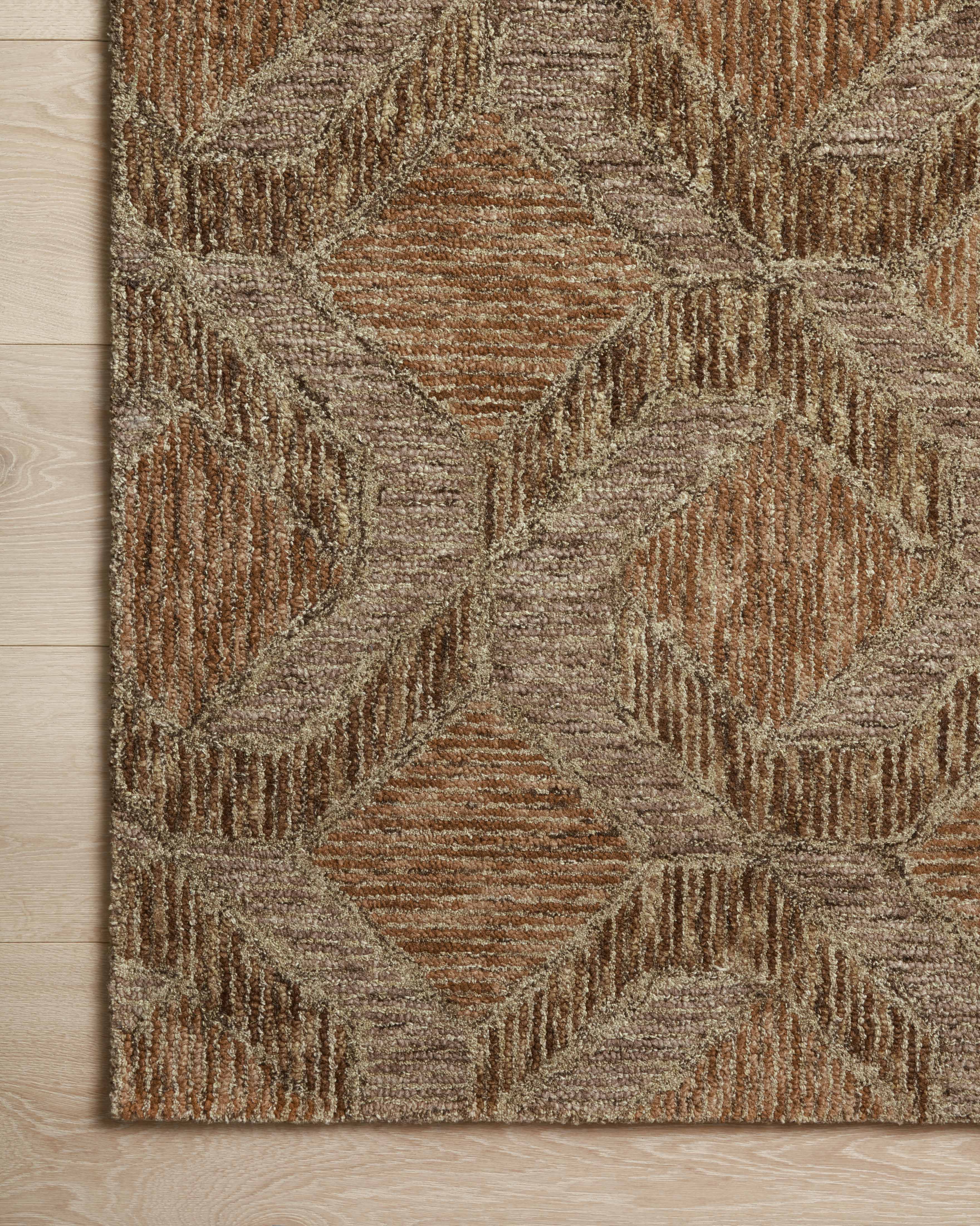 Finished in warm rust and grounded bark tones with graphic styling, the Varena VAR-03 Rust / Bark Area Rug is a hand-tufted 100% wool area rug for modern living