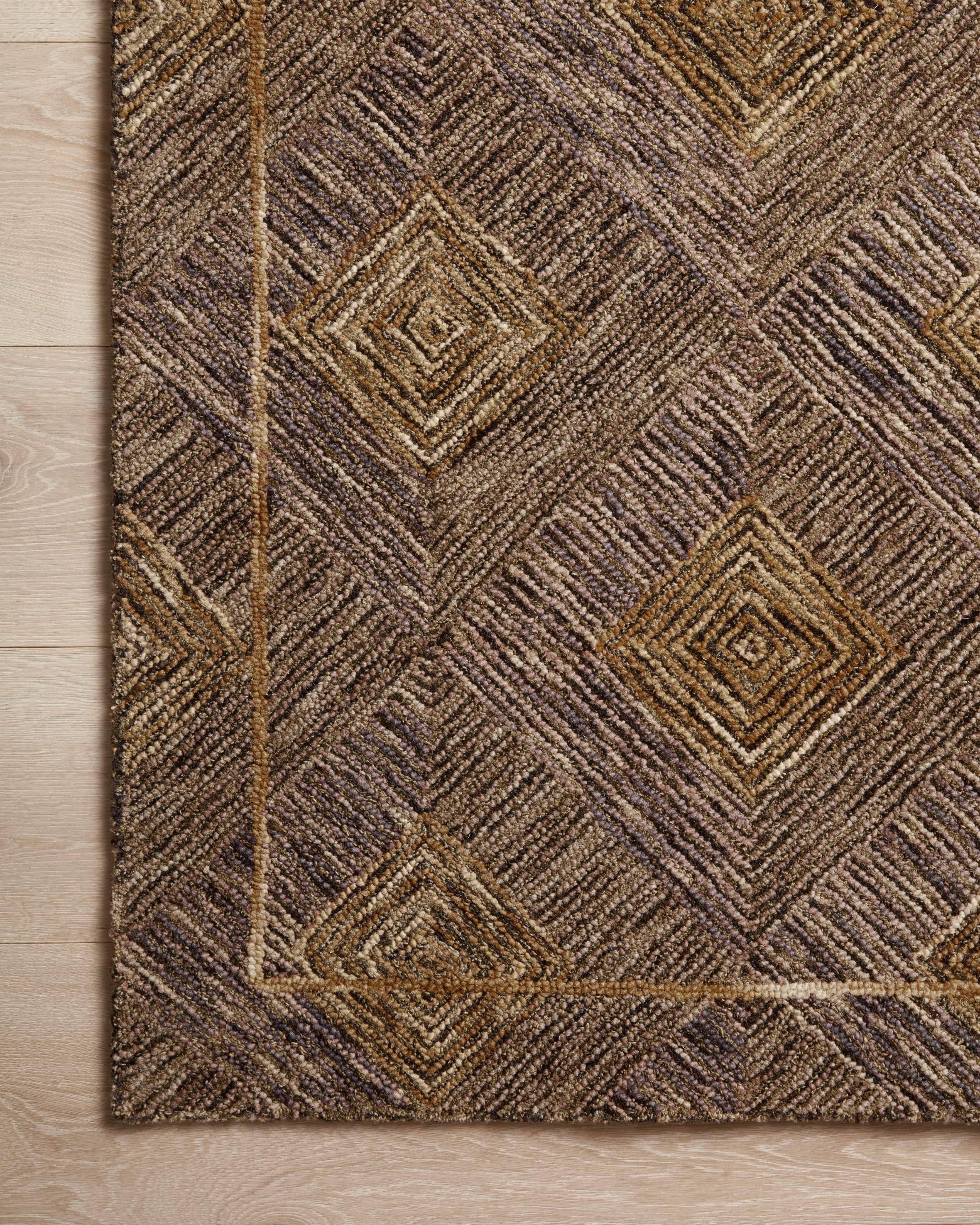 A hand-tufted 100% wool area rug with graphic design in regal plum and radiant gold hues, the Varena VAR-04 Plum / Gold Area Rug is a standout in any décor