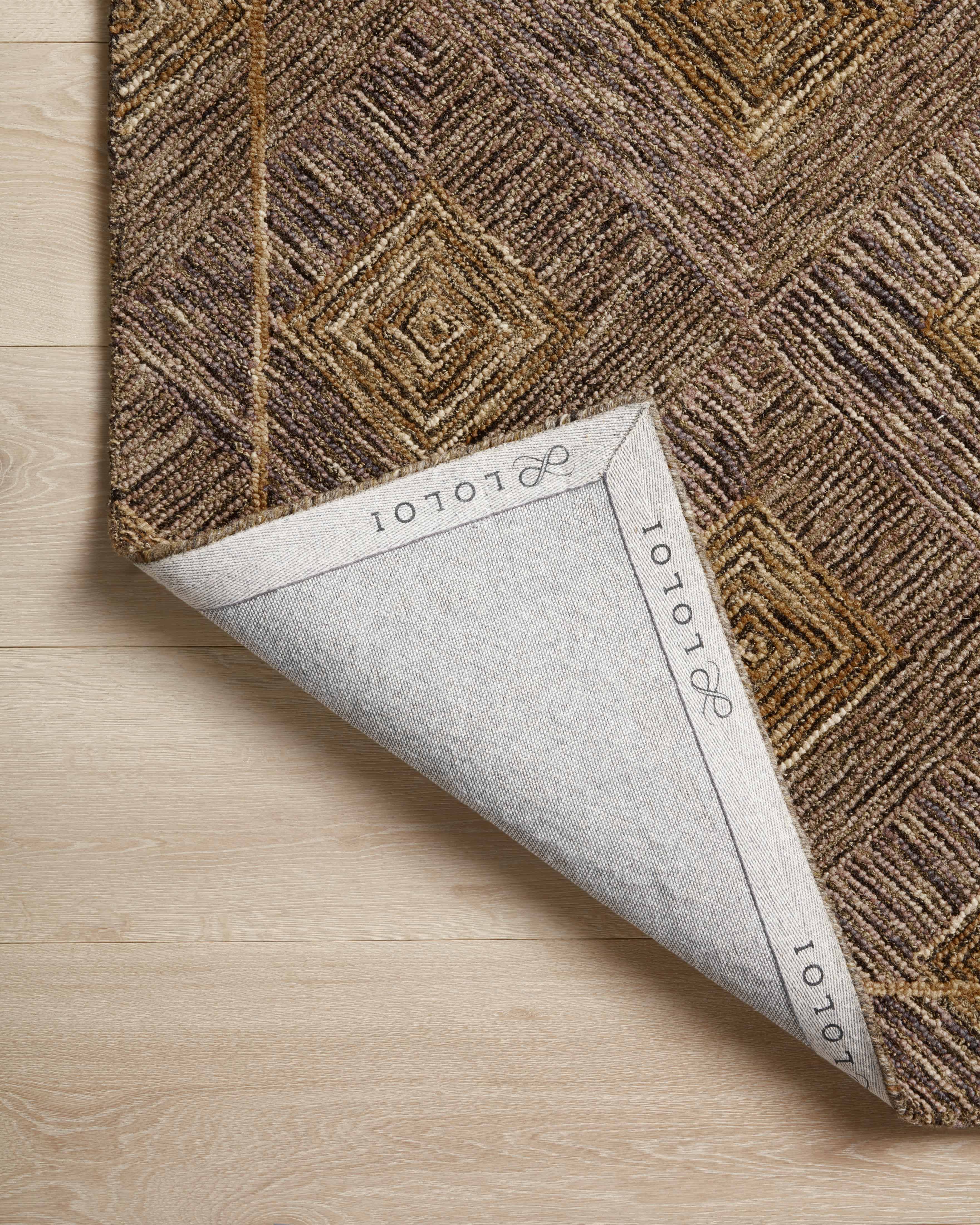 A hand-tufted 100% wool area rug with graphic design in regal plum and radiant gold hues, the Varena VAR-04 Plum / Gold Area Rug is a standout in any décor