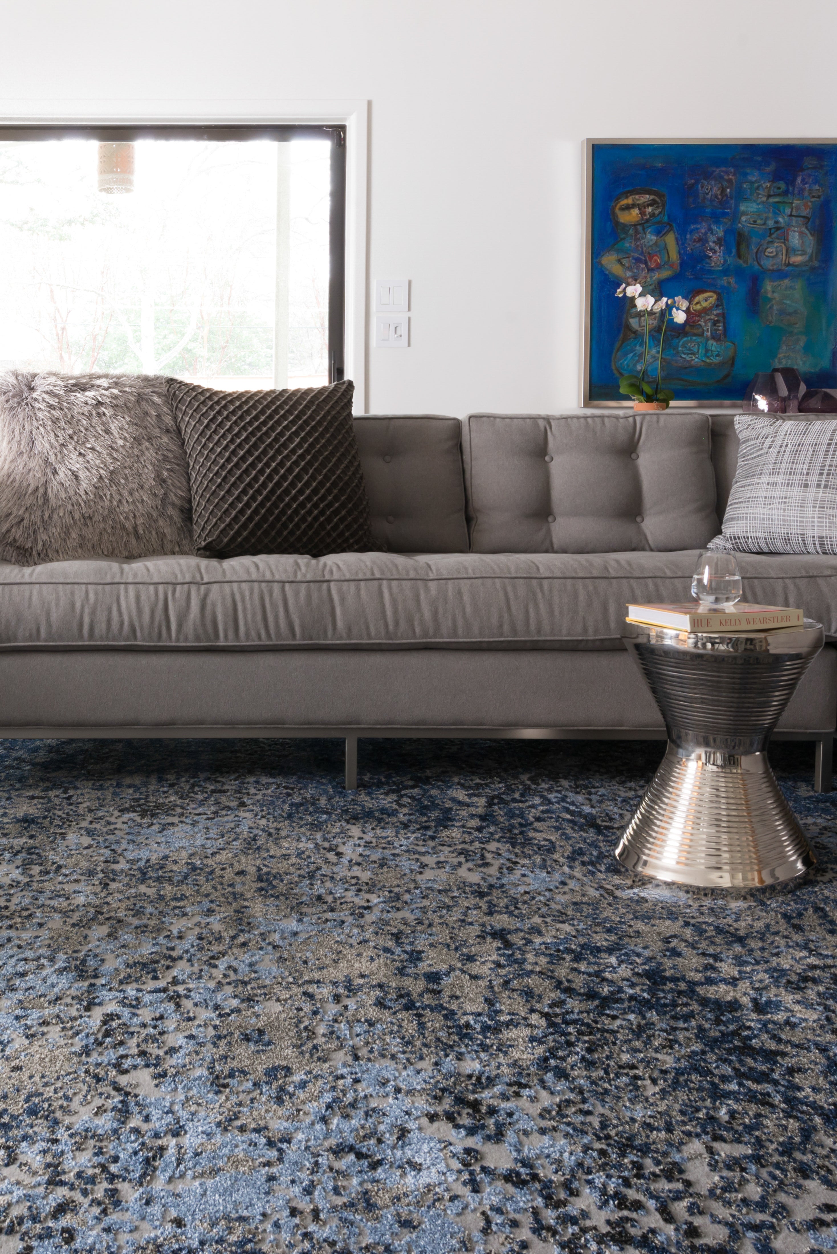 A power-loomed polypropylene and polyester area rug in elegant grey and classic navy tones with contemporary and vintage motifs, the Viera VR-07 Grey / Navy Area Rug grounds your room beautifully
