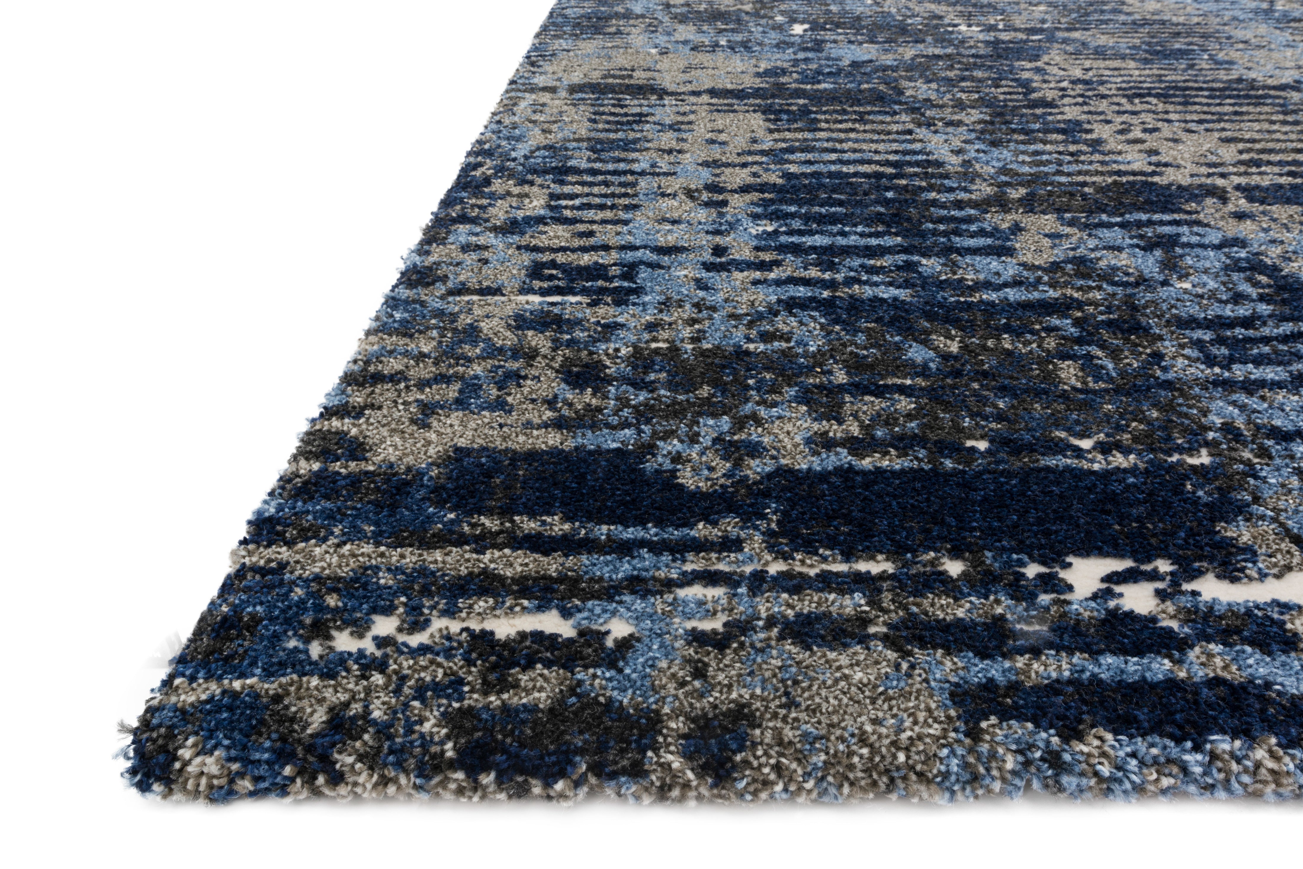 Layered in dark blue and elegant grey hues with contemporary and vintage patterns, the Viera VR-09 Dark Blue / Grey Area Rug is a power-loomed polypropylene and polyester area rug perfect for any setting