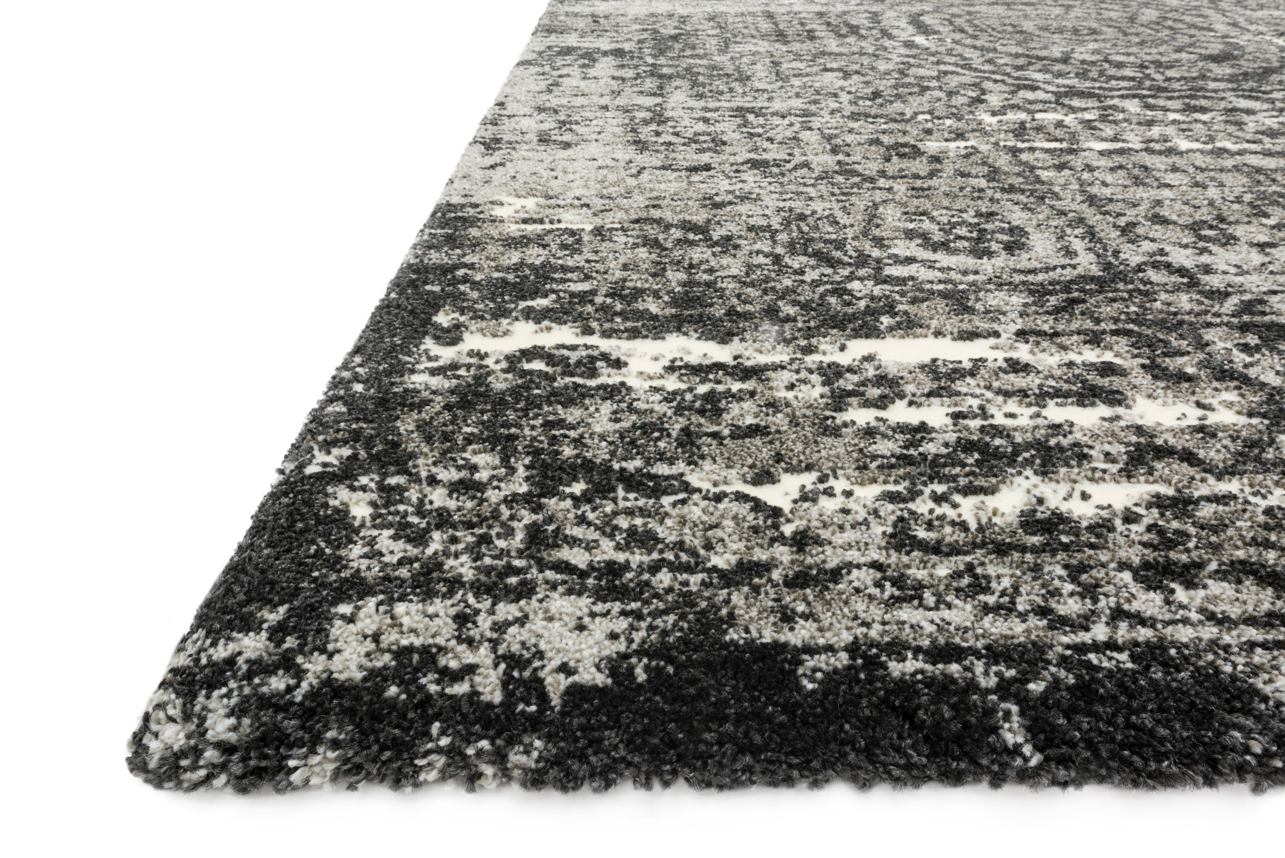 Featuring graphite and dramatic black hues and contemporary and vintage detail, the Viera VR-11 Graphite / Black Area Rug is a power-loomed polypropylene and polyester area rug for any room