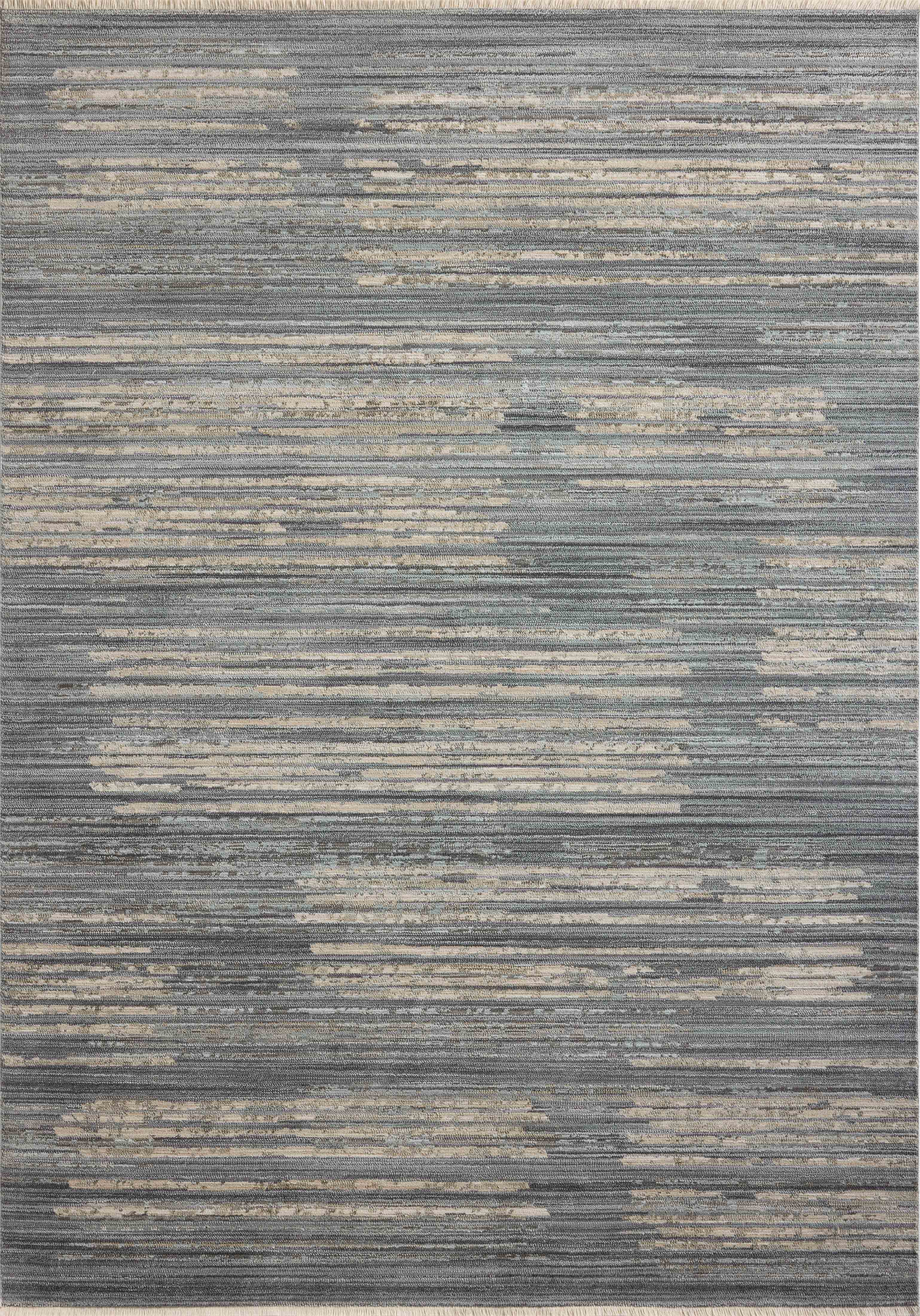 A power-loomed 100% polyester area rug with abstract and linear flair in serene ocean and sandy tones, the Wade WAE-02 Ocean / Sand Area Rug anchors any room