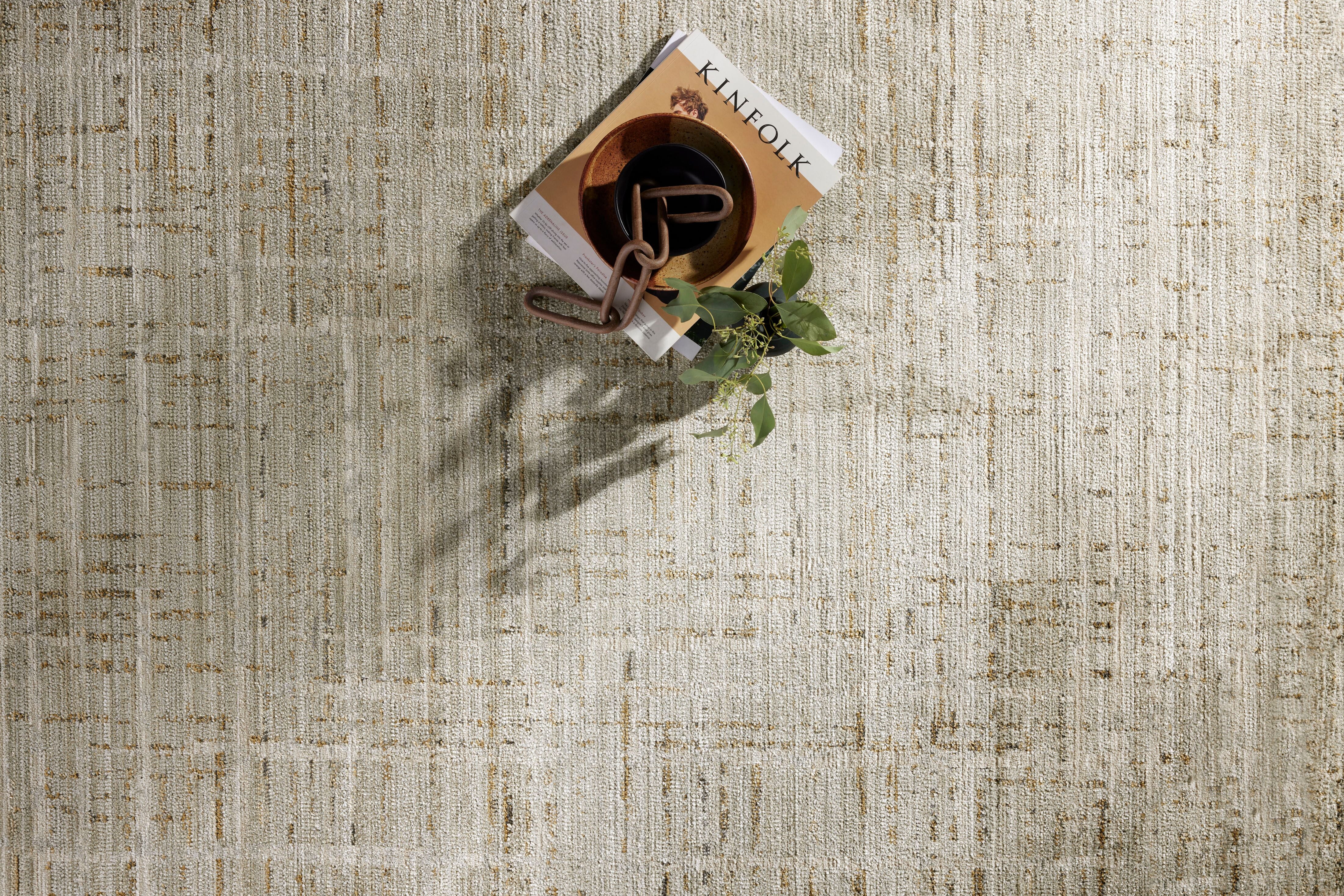 Crafted as a power-loomed 100% polyester area rug, the Wade WAE-03 Mist / Gold Area Rug brings soft misty and radiant gold warmth and abstract and linear character to your space