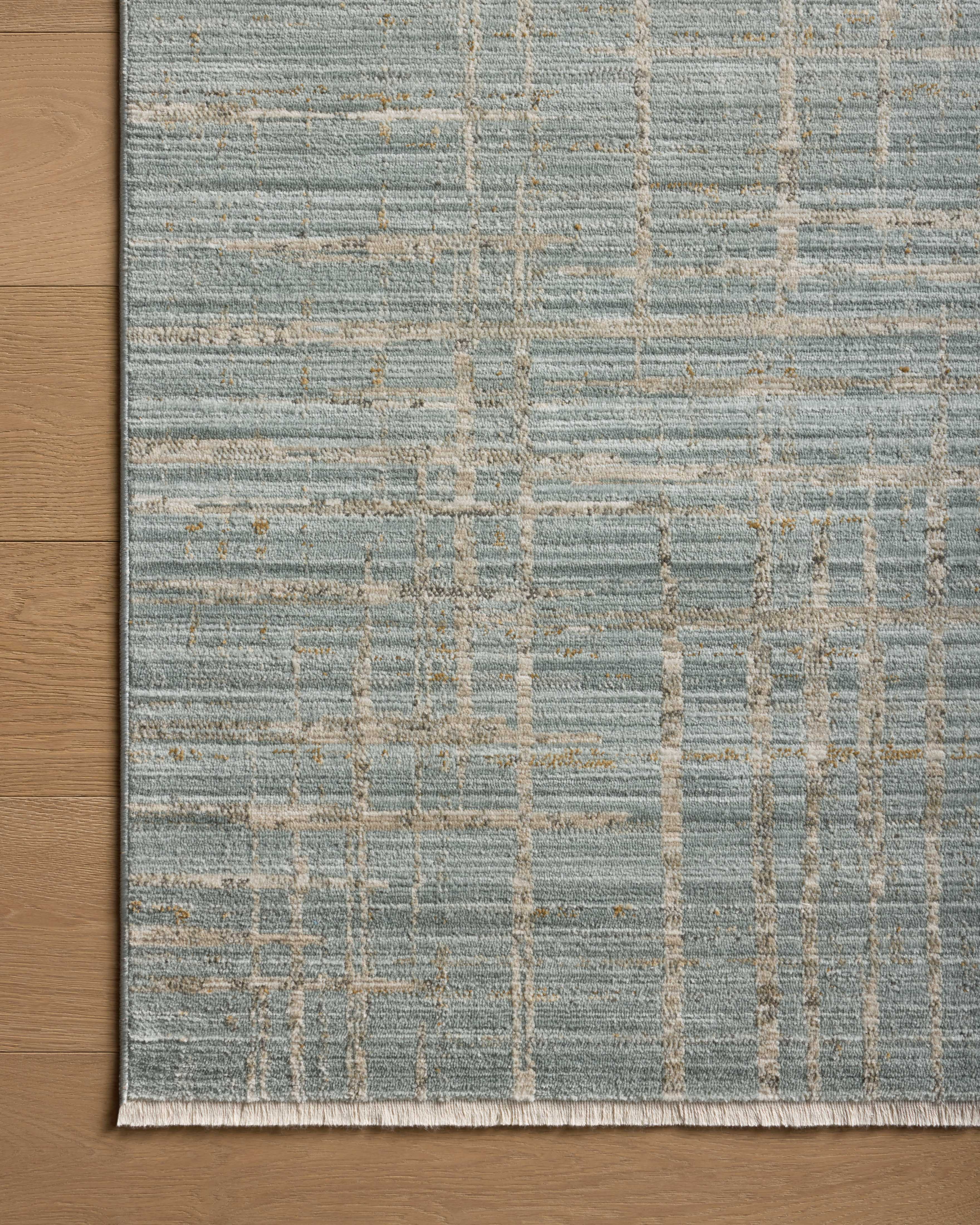 With spa and sandy hues and abstract and linear styling, the Wade WAE-03 Spa / Sand Area Rug is a power-loomed 100% polyester area rug that elevates any room