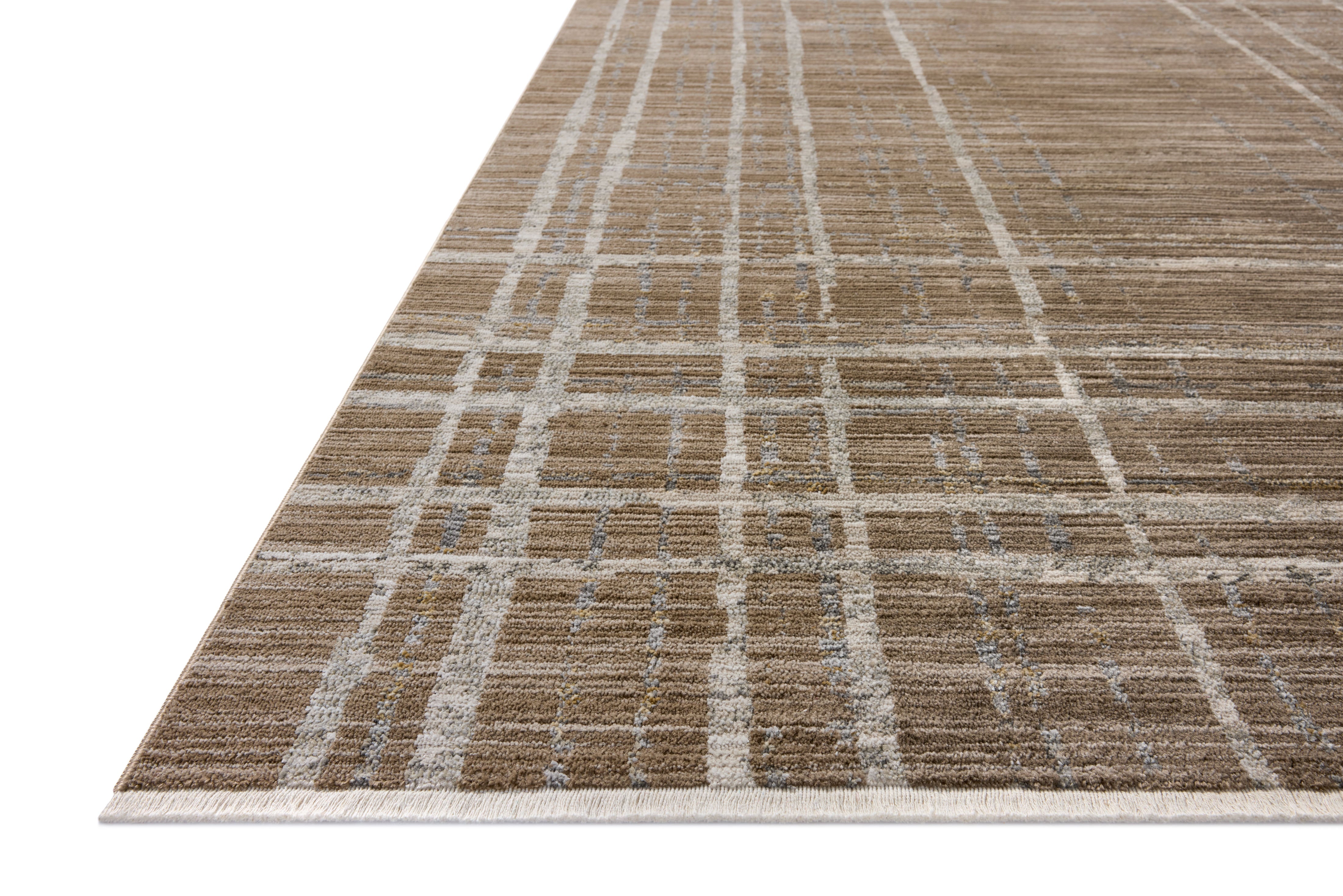 Designed with abstract and linear artistry in brown and grounding stone hues, the Wade WAE-05 Brown / Stone Area Rug is a power-loomed 100% polyester area rug that stands out