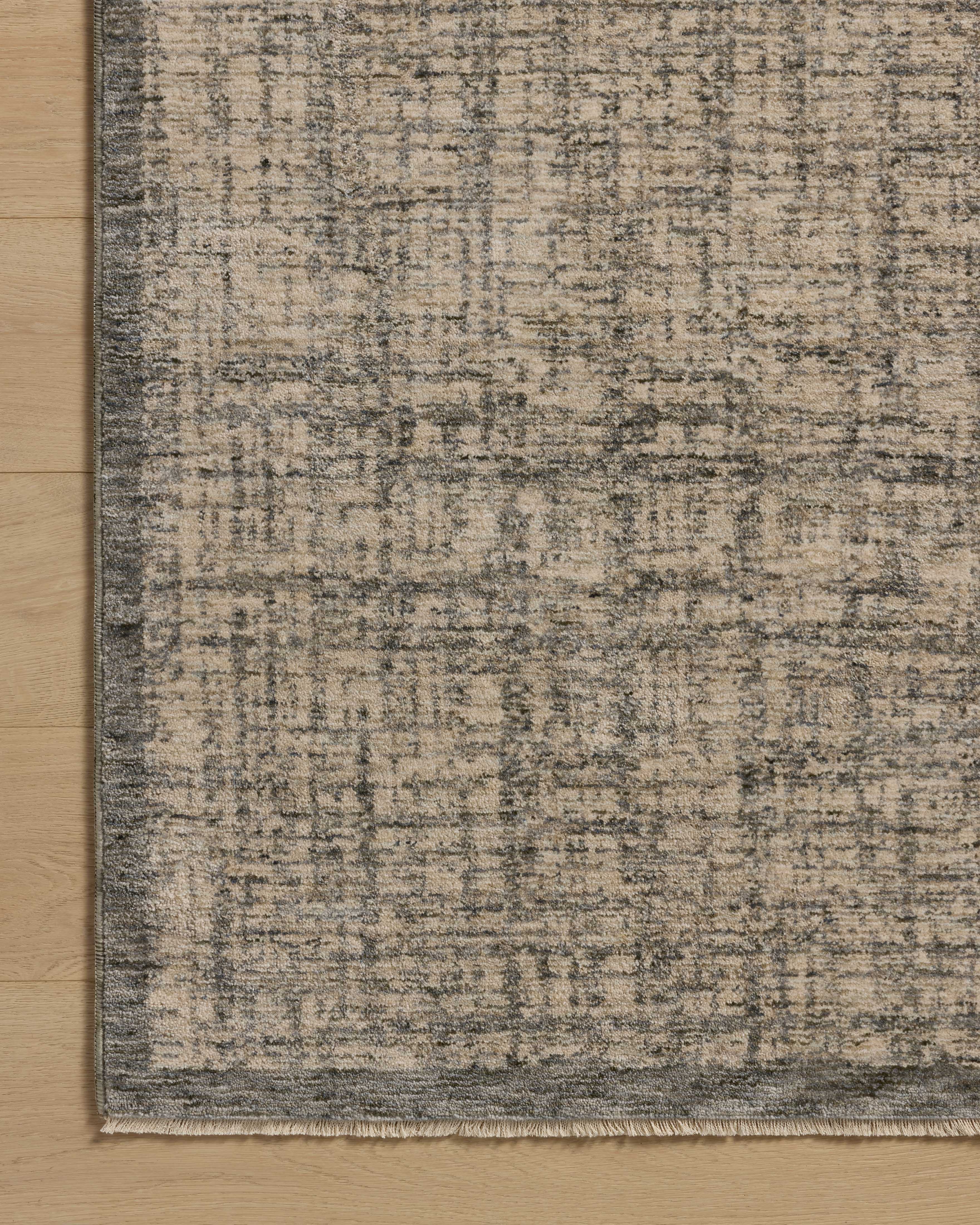A power-loomed polyester area rug in casual denim and bone tones, the Winston WIT-01 Denim / Bone Area Rug grounds your room beautifully