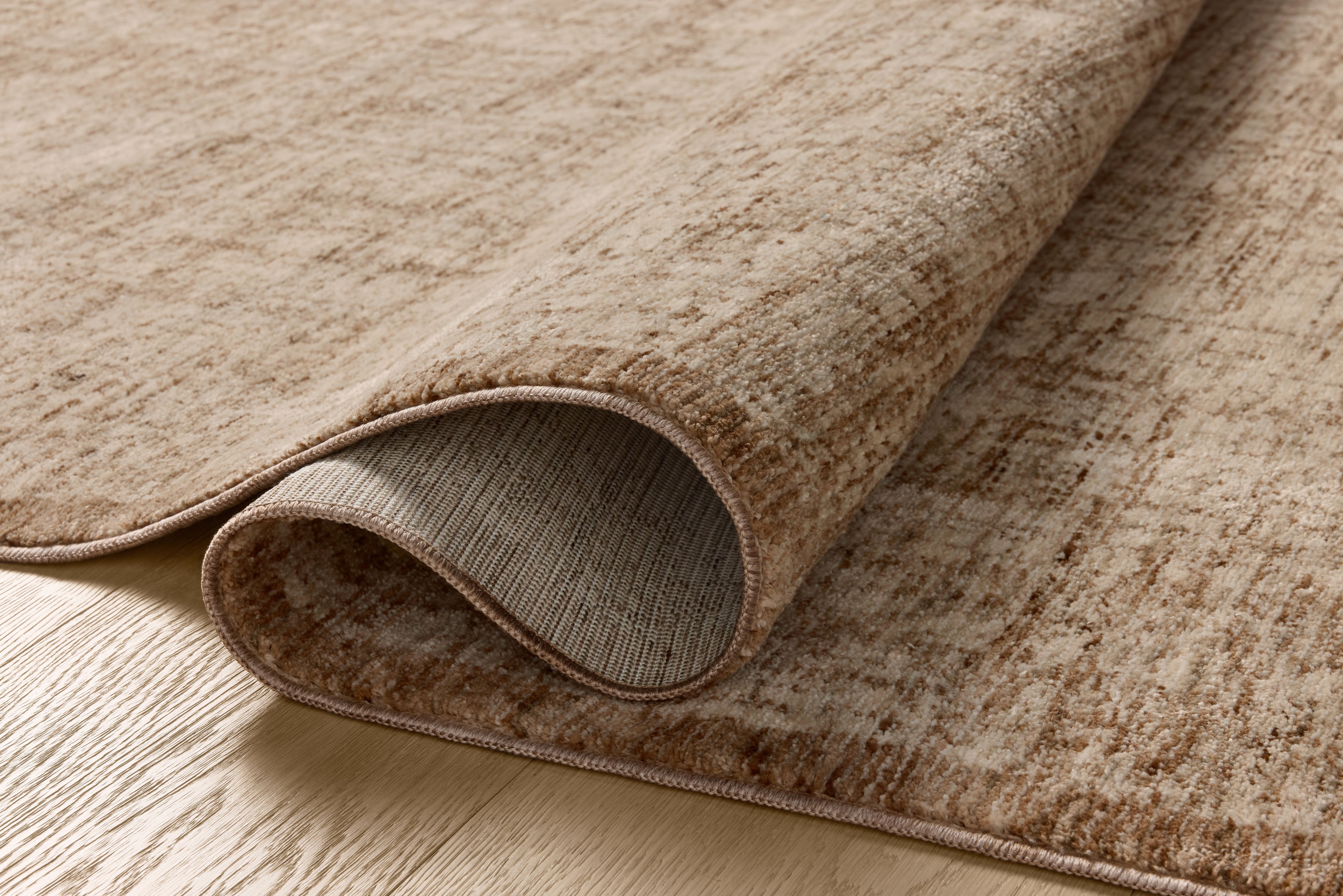 The Winston WIT-01 Earth / Bone Area Rug is a power-loomed polyester area rug that radiates earthy and bone charm