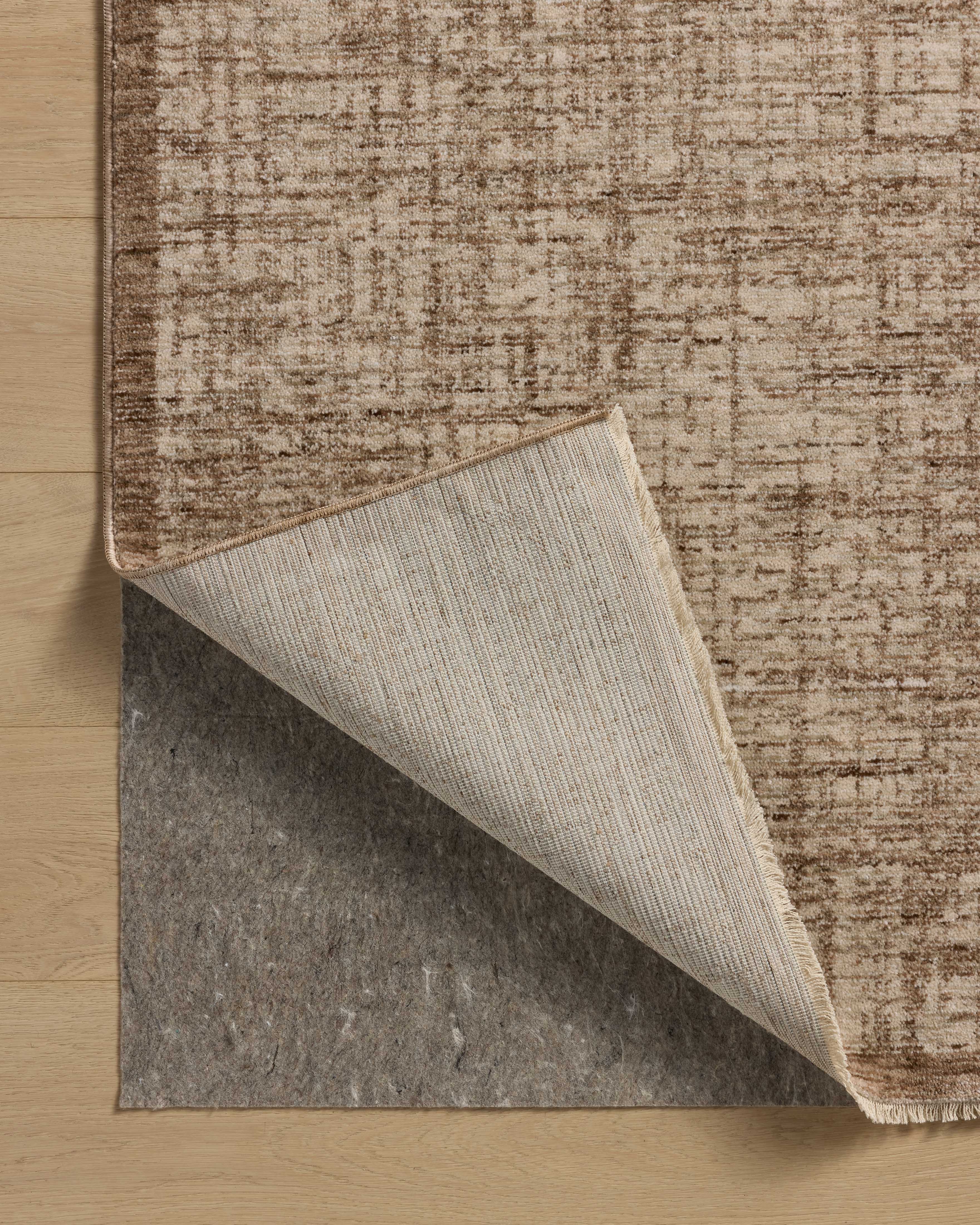 The Winston WIT-01 Earth / Bone Area Rug is a power-loomed polyester area rug that radiates earthy and bone charm