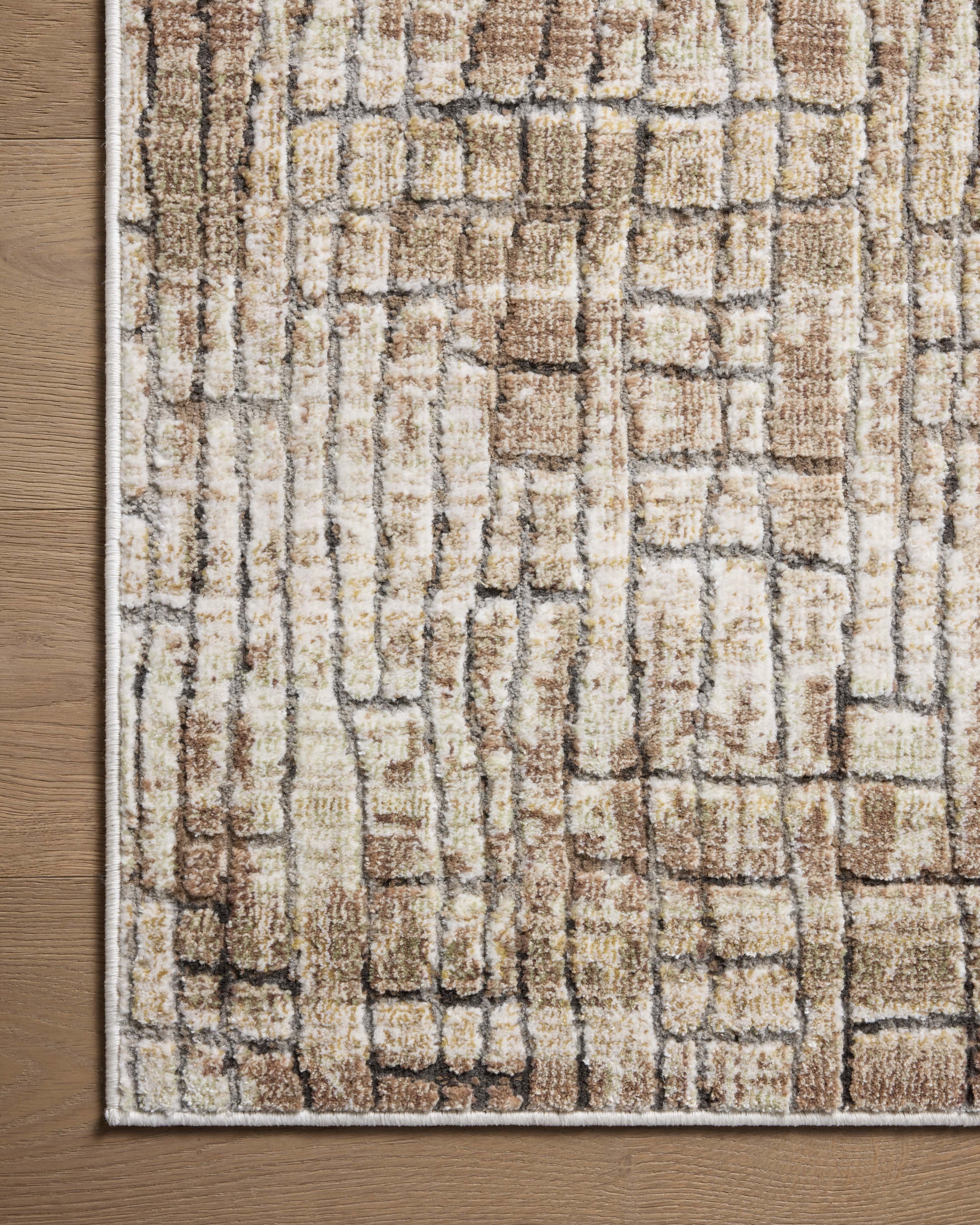 Finished in earthy clay and smoky tones with distressed styling, the Wyatt WYA-07 Clay / Smoke Area Rug is a power-loomed polypropylene and polyester area rug for modern living