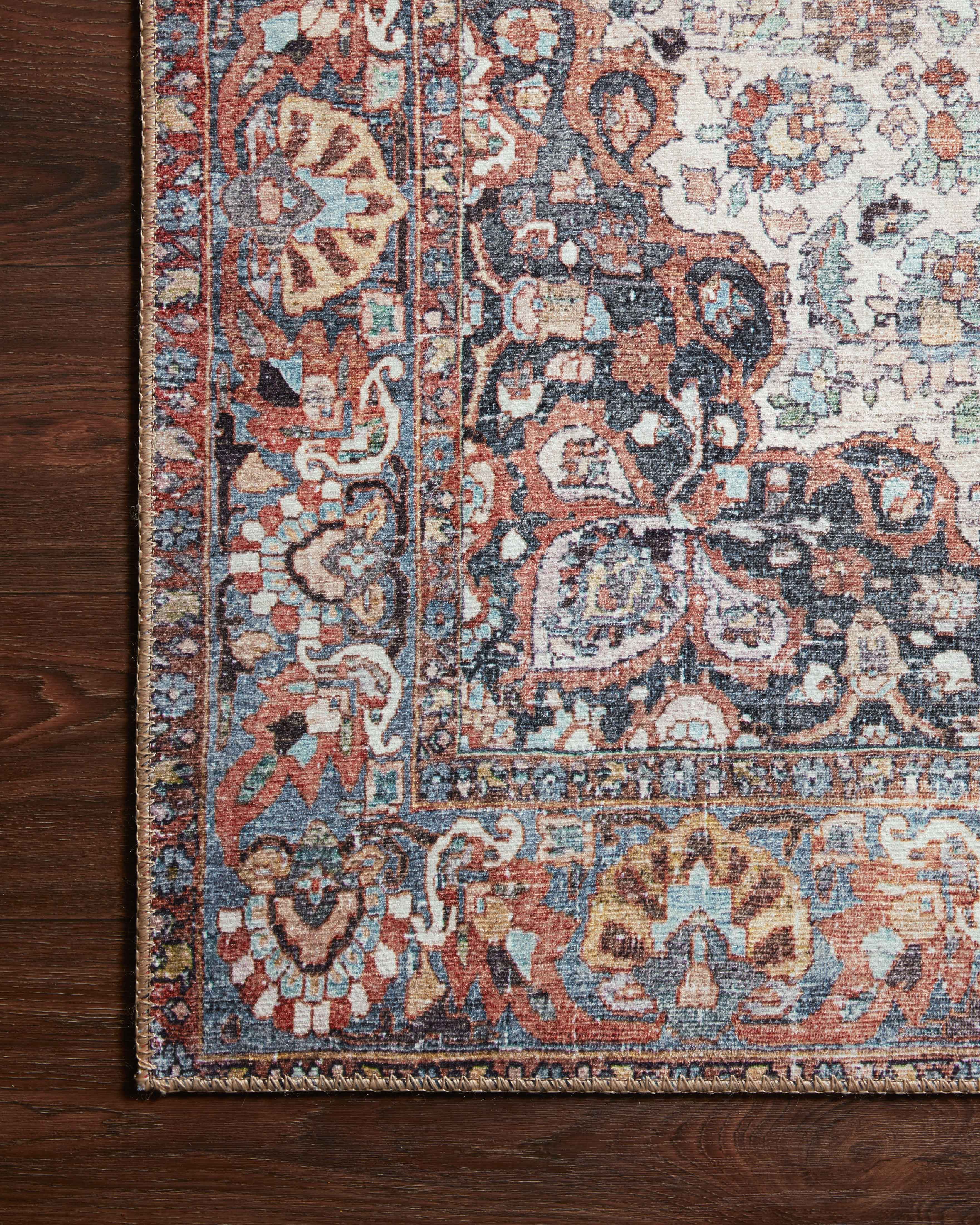 A power-loomed 100% polyester area rug in bold red and vibrant multi-toned hues, the Wynter WYN-01 Red / Multi Area Rug is a standout in any décor