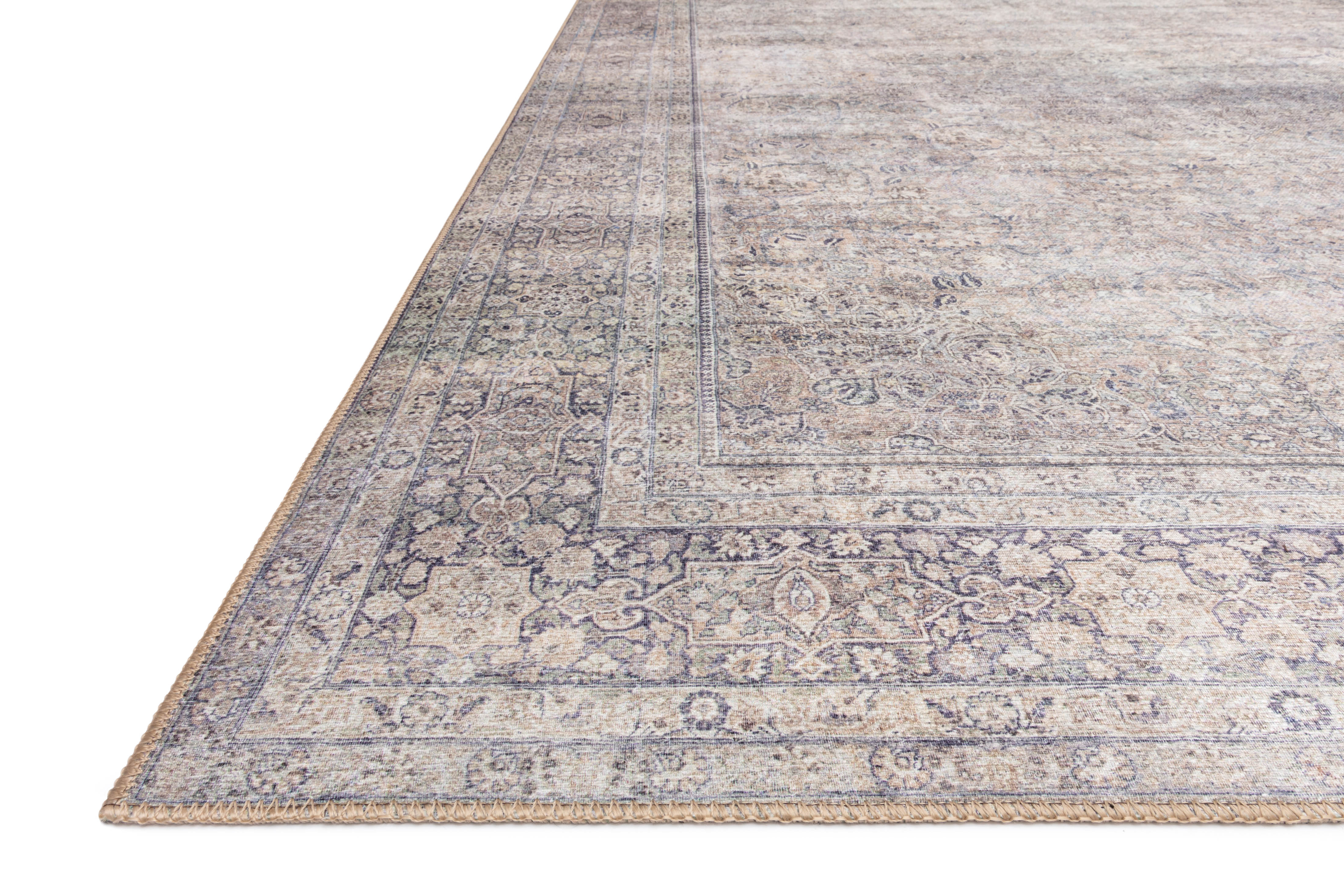 Dressed in shimmering silver and deep charcoal hues, the Wynter WYN-03 Silver / Charcoal Area Rug is a power-loomed 100% polyester area rug that completes any room