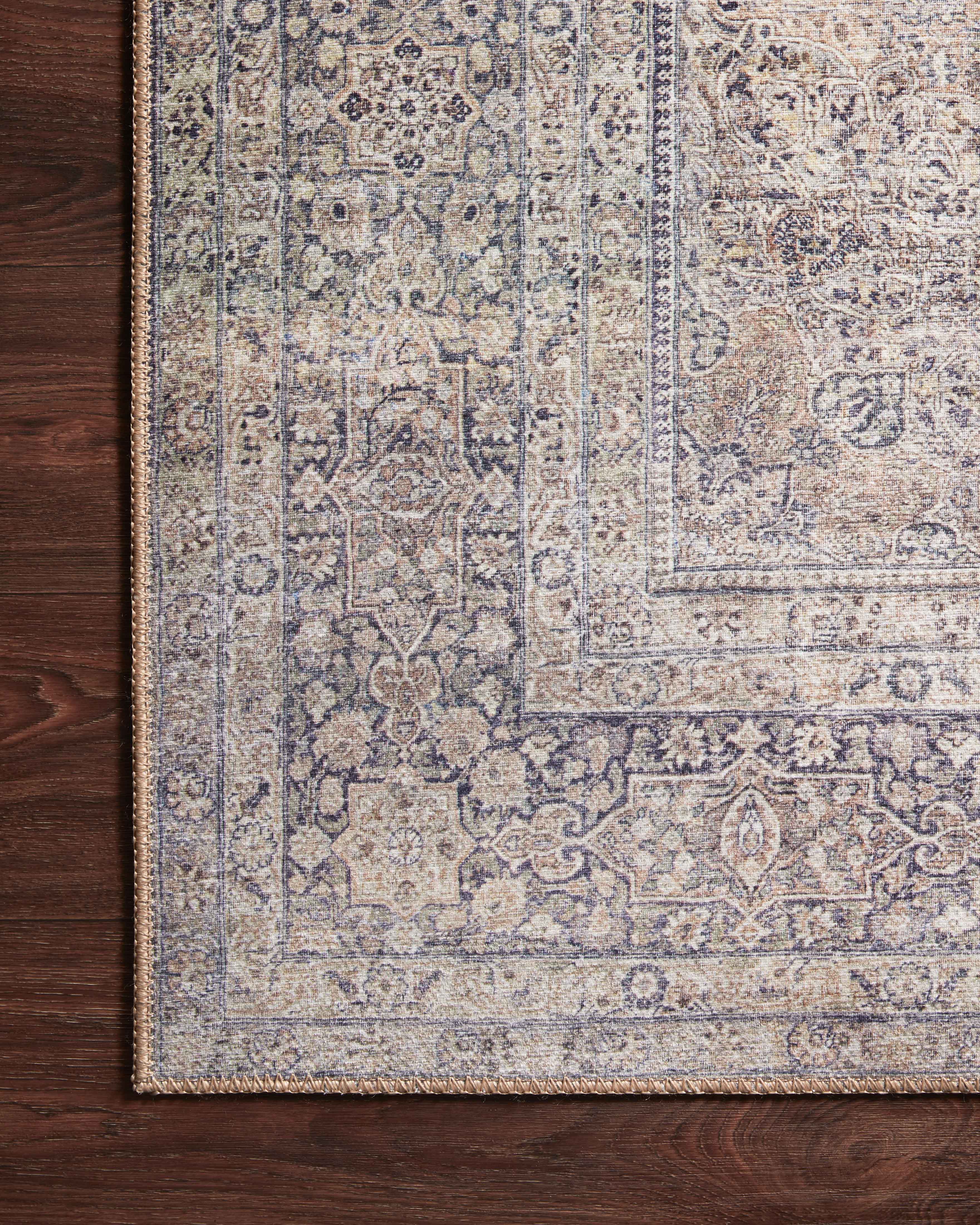 Dressed in shimmering silver and deep charcoal hues, the Wynter WYN-03 Silver / Charcoal Area Rug is a power-loomed 100% polyester area rug that completes any room
