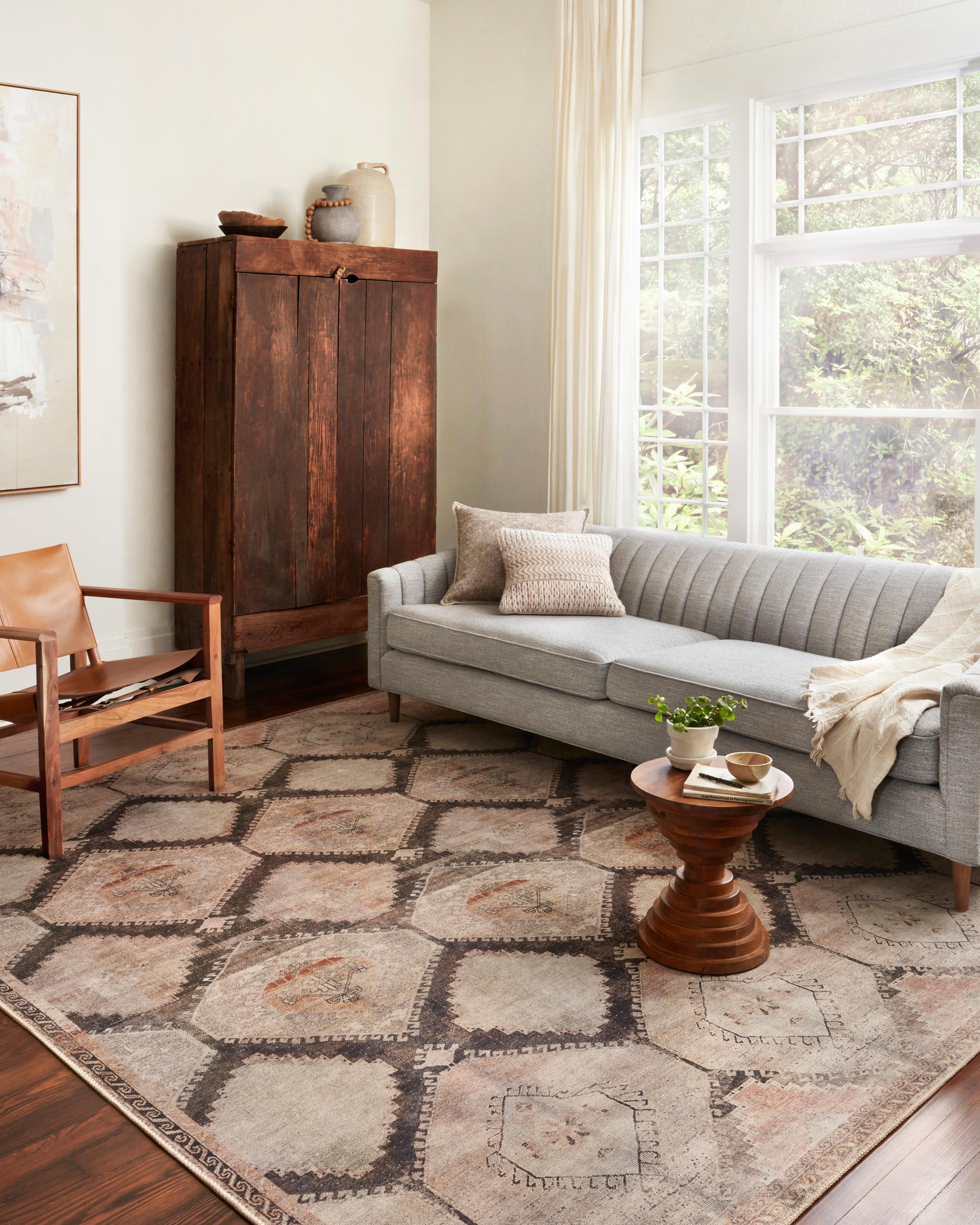 The Wynter WYN-08 Graphite / Blush Area Rug showcases graphite and delicate blush tones in a power-loomed 100% polyester area rug