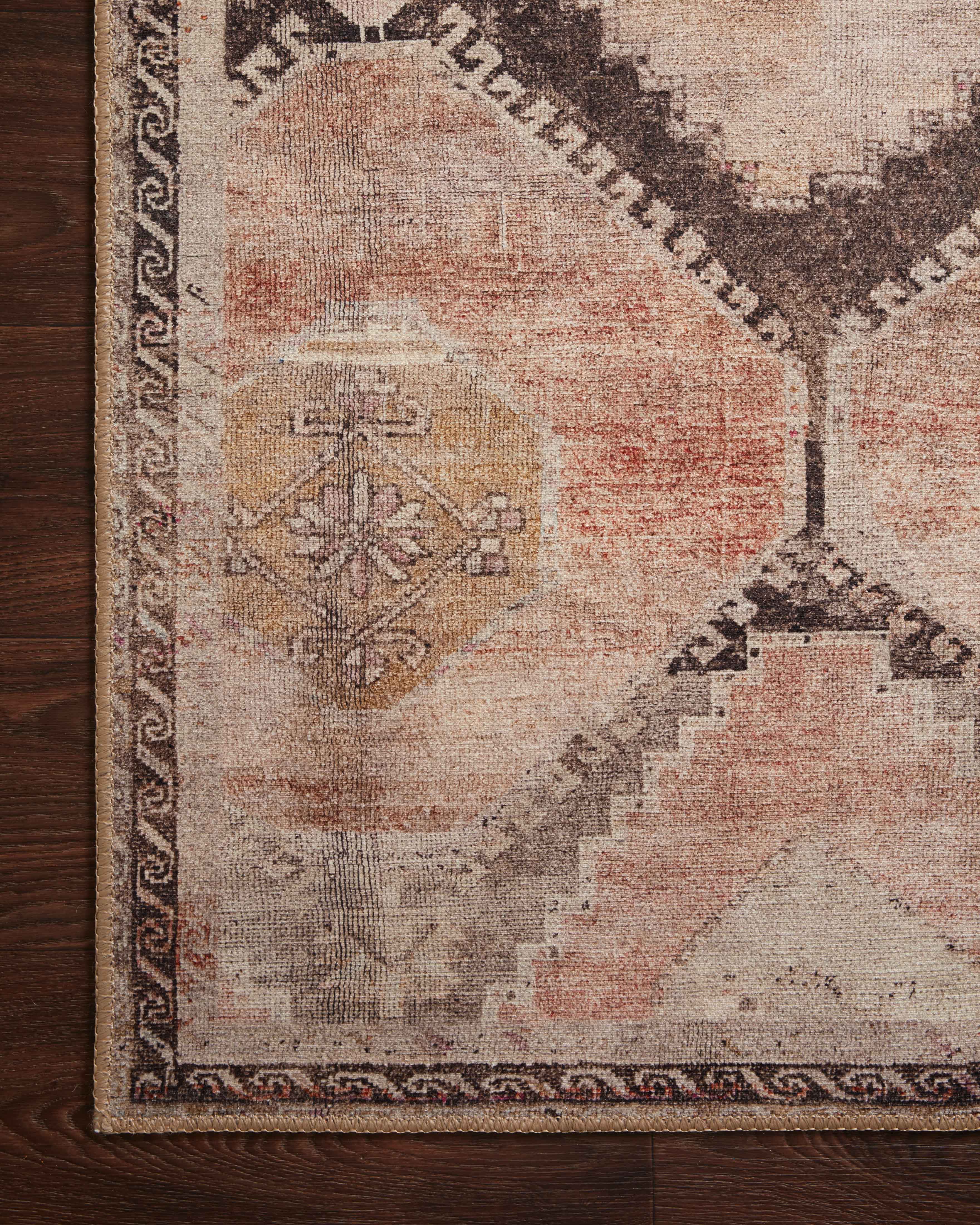 The Wynter WYN-08 Graphite / Blush Area Rug showcases graphite and delicate blush tones in a power-loomed 100% polyester area rug